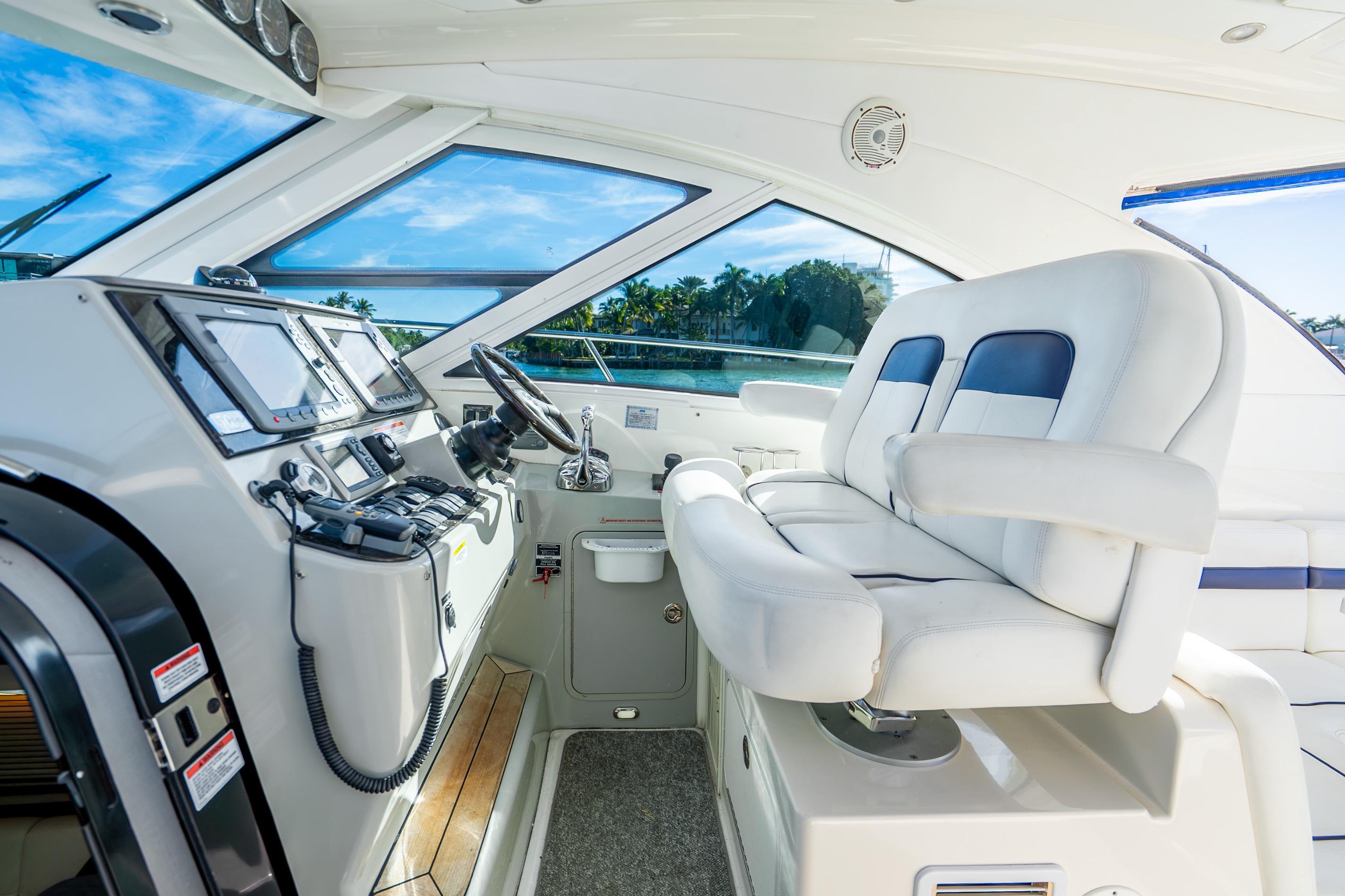 2009 Sea Ray 470 Sundancer helm with modern controls and plush seating.