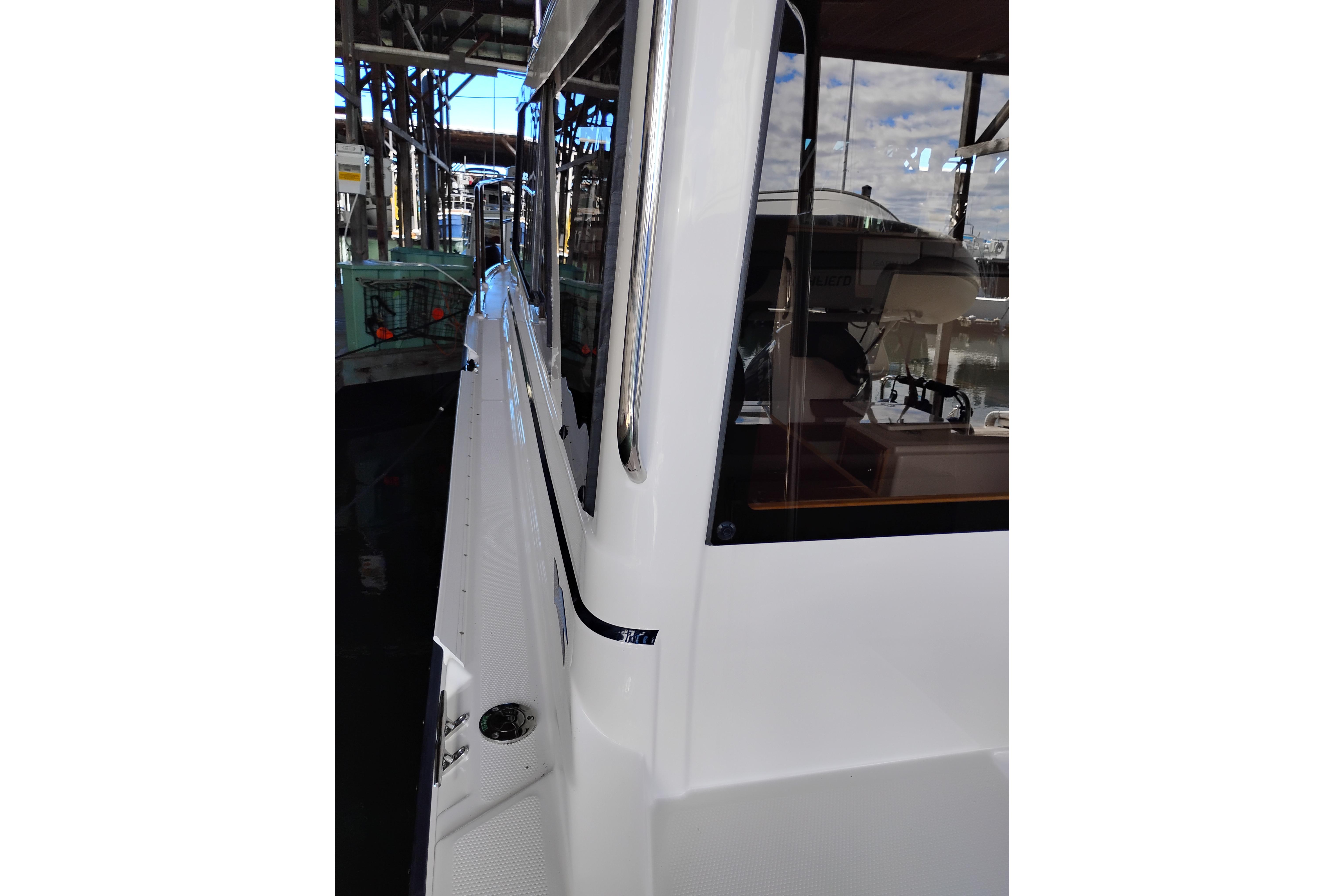 2022 Cutwater C-32 Coupe side view, showcasing sleek design and modern features.