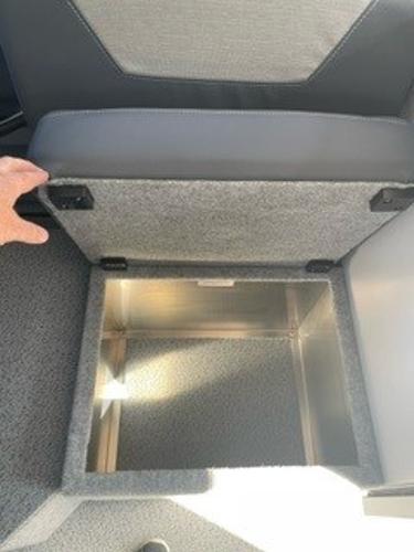 2025 Spartan 2600 Olympia interior storage compartment with open lid.