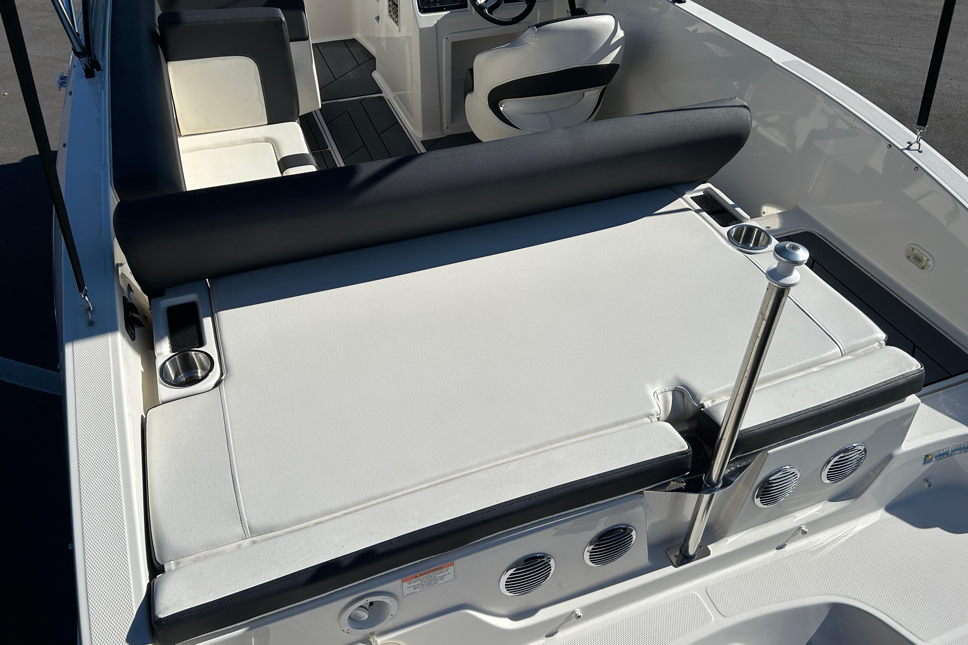 Bayliner DX 2000 2020 boat interior with seating and cup holders.