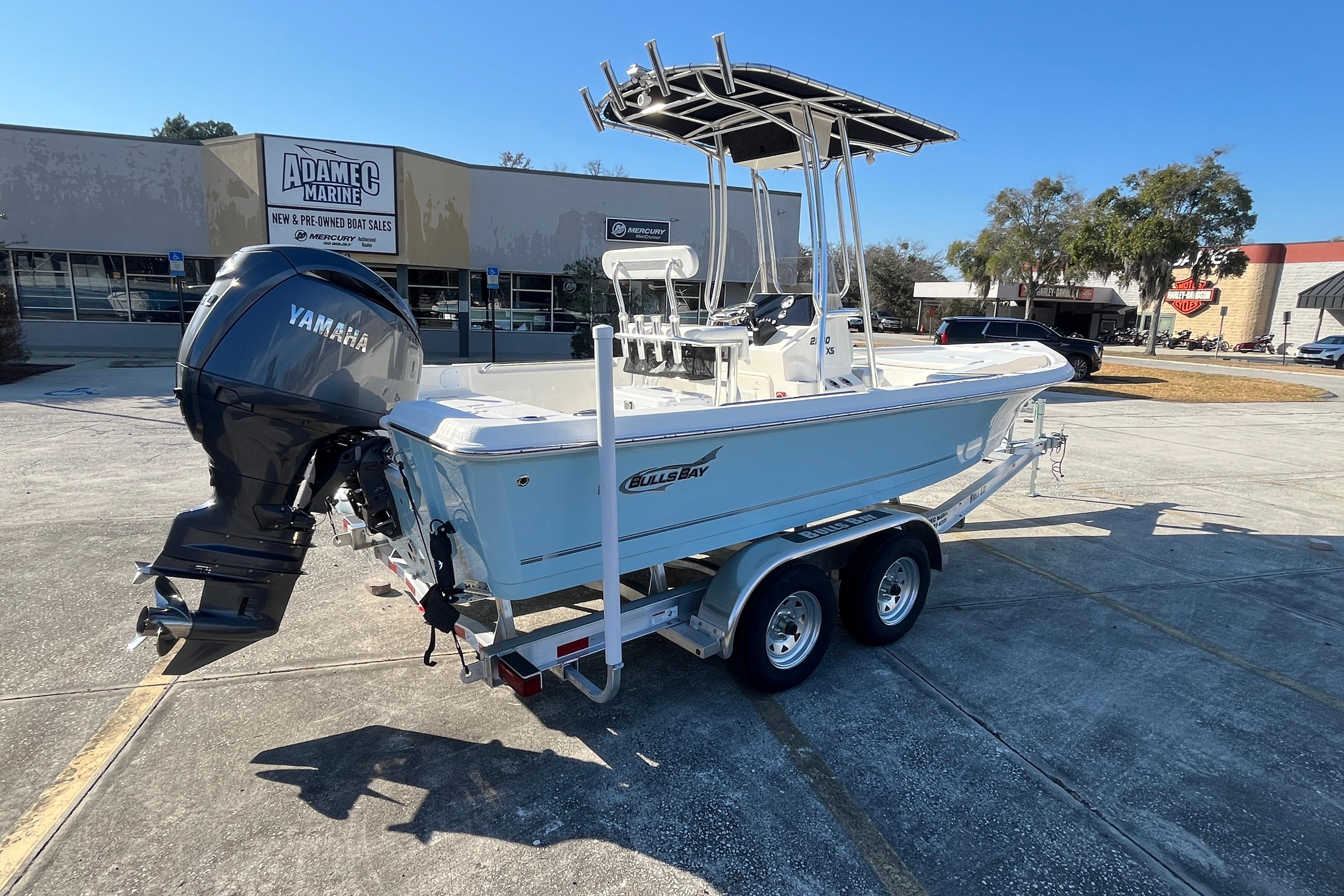 2026 Bulls Bay 2200 boat with Yamaha engine on trailer at dealership.