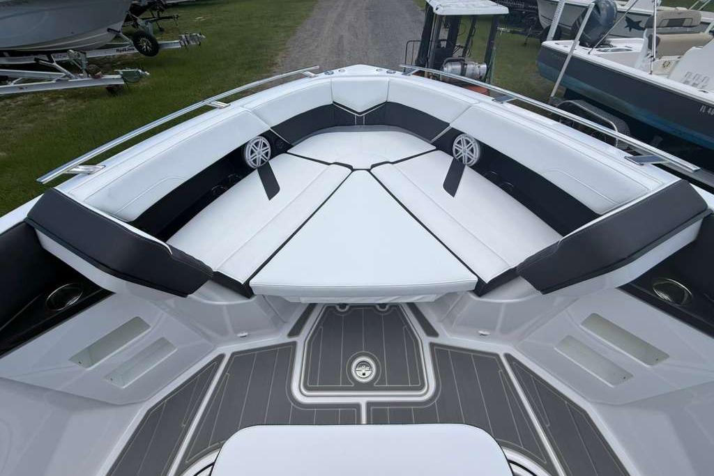Luxurious seating area on the 2026 Monterey Elite 30 OB boat, featuring sleek design and comfort.
