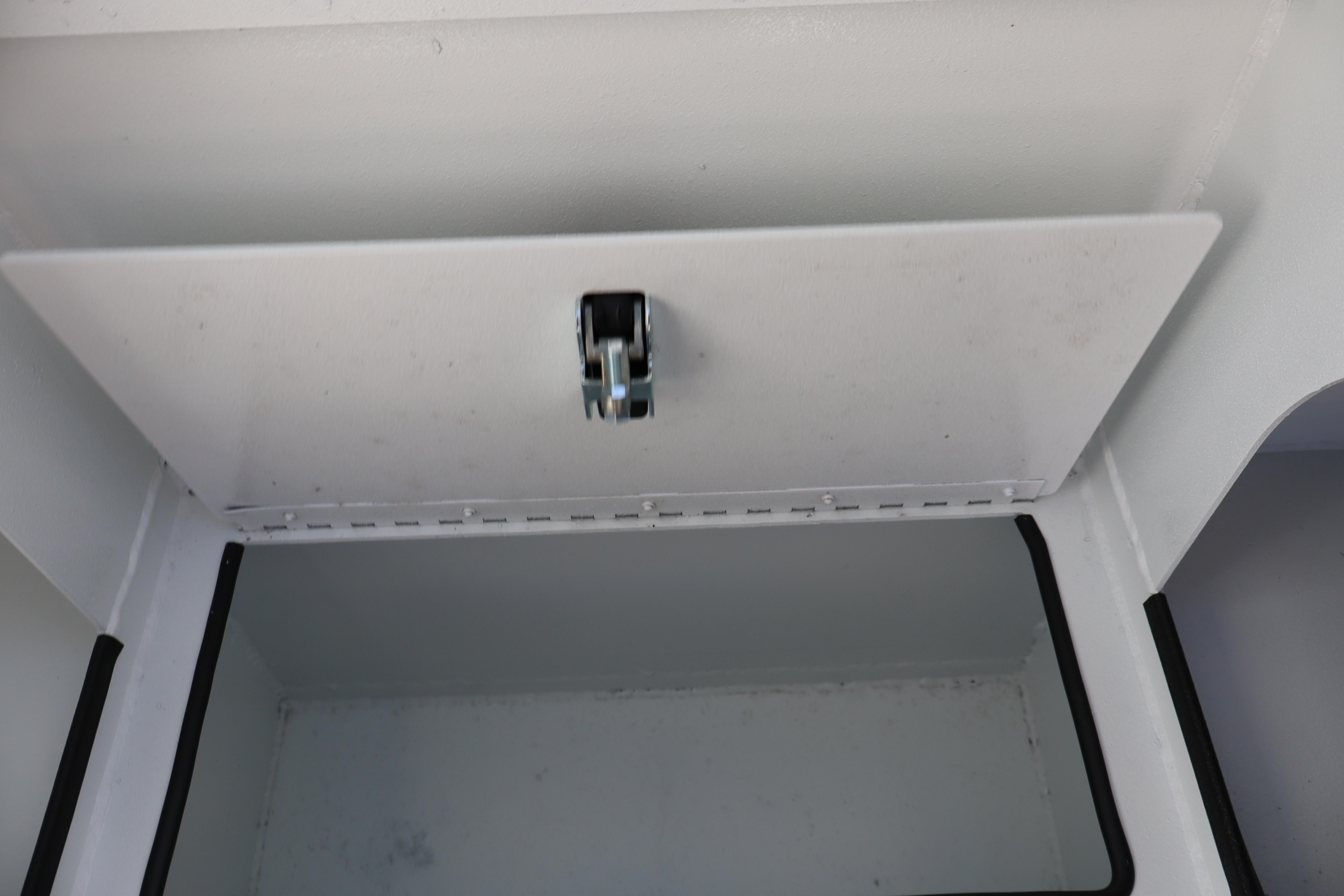Storage compartment of 2026 Alumaweld Stryker 202 boat, featuring a secure latch.