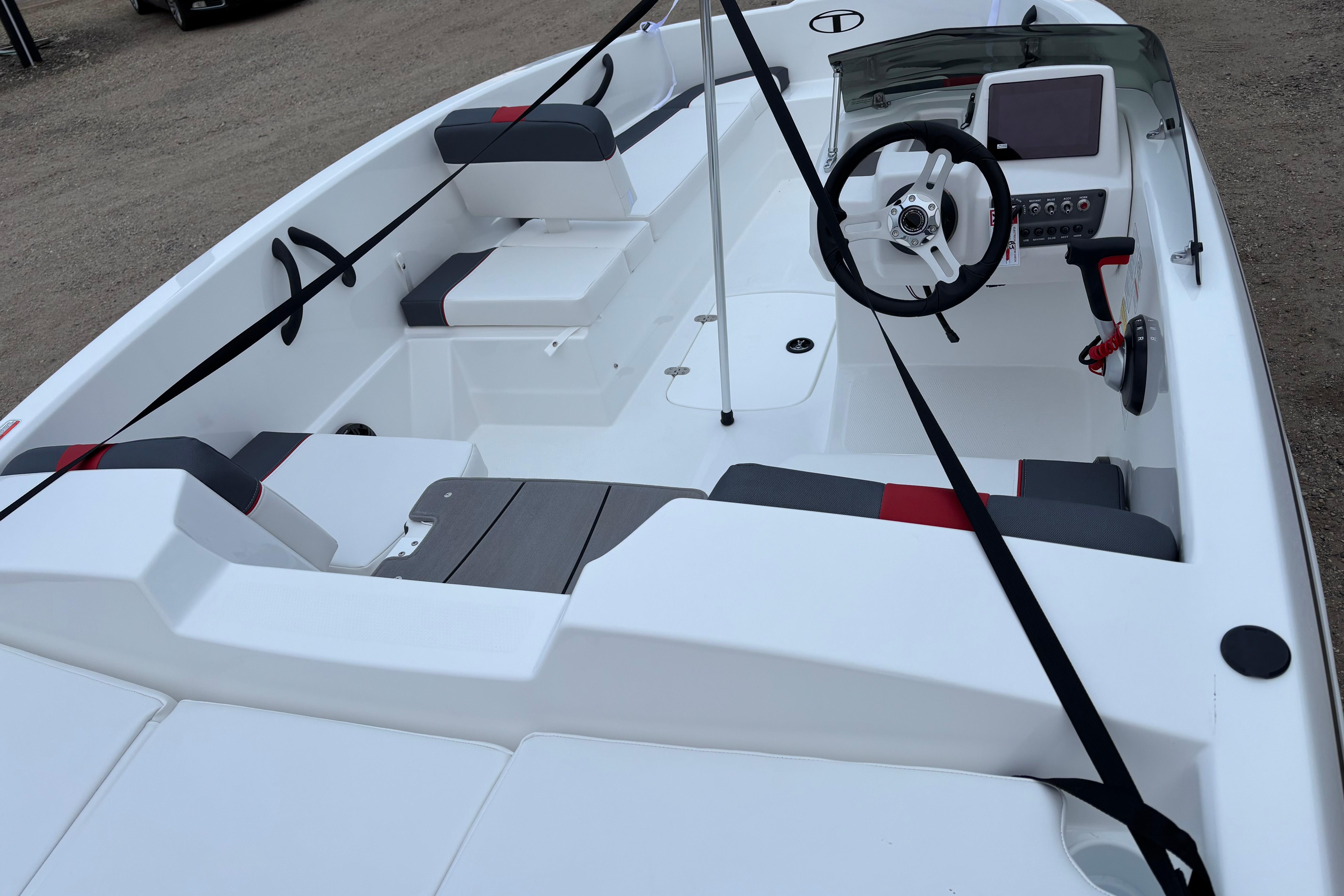 2026 Tahoe T16 boat interior with modern steering and seating design.