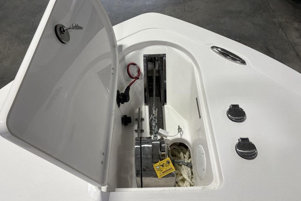 Anchor compartment of 2026 Tidewater 232 CC Adventure boat, featuring storage and hardware.