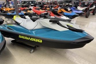 2024 Sea-Doo GTI SE 130 jet ski in showroom, featuring sleek blue design.