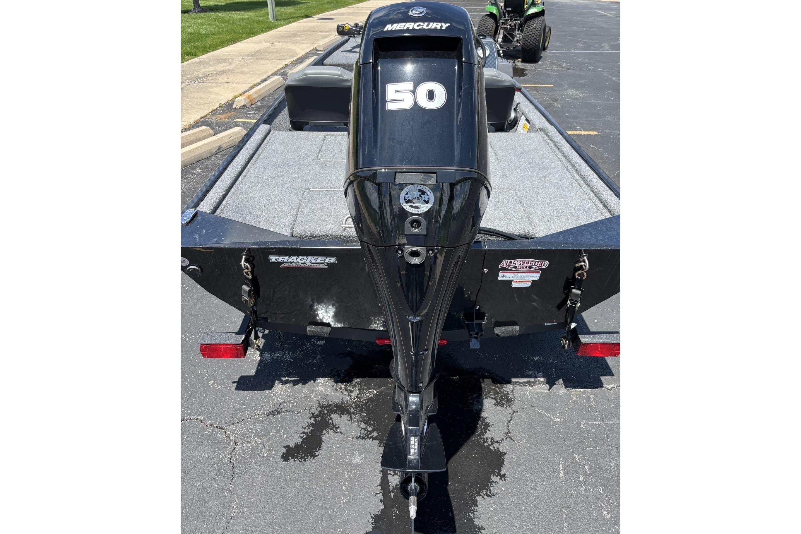 2026 Tracker Bass Tracker Classic XL with Mercury 50 engine, parked on pavement.
