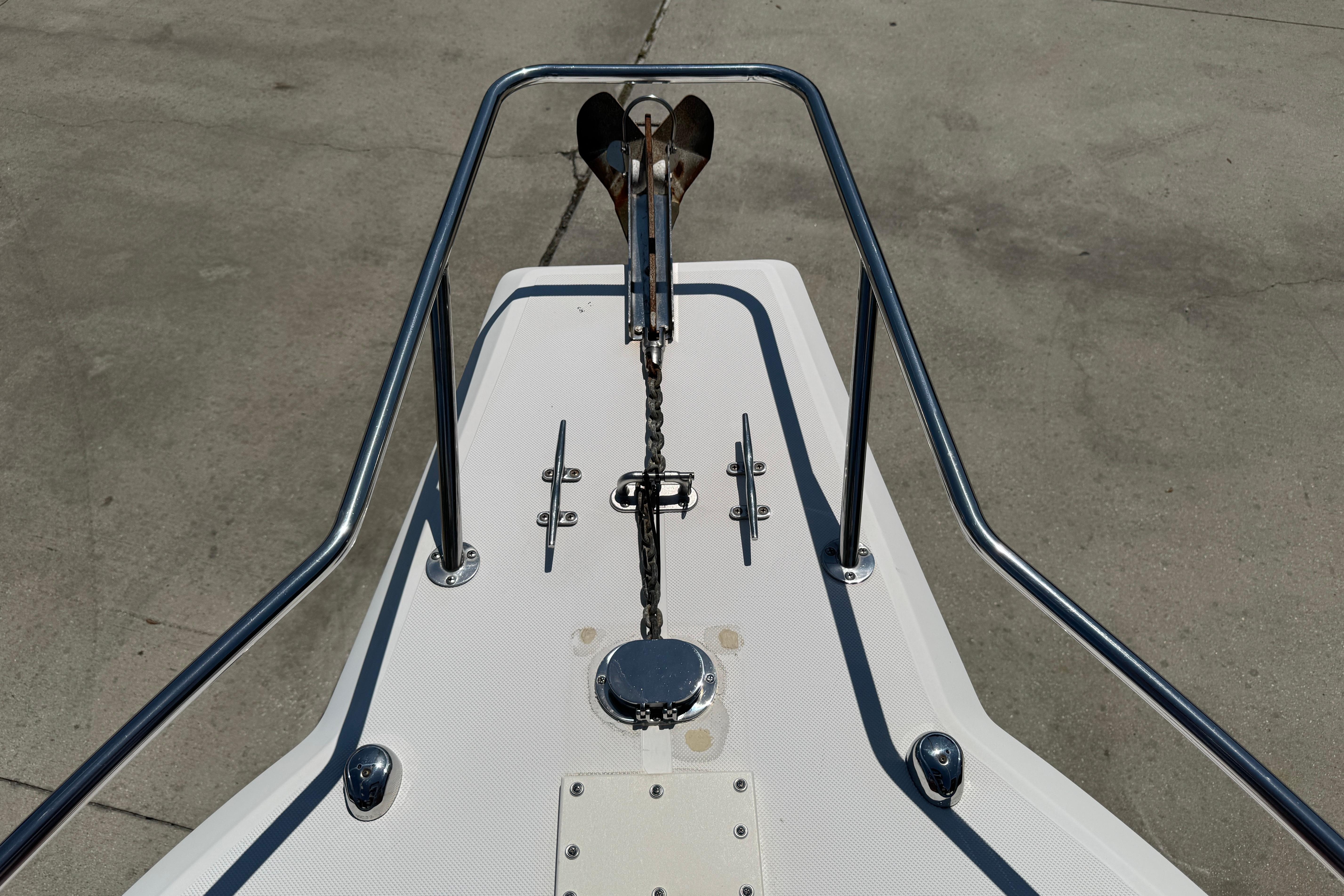 Bow of 2000 Stamas 250 Tarpon boat with anchor and railings.