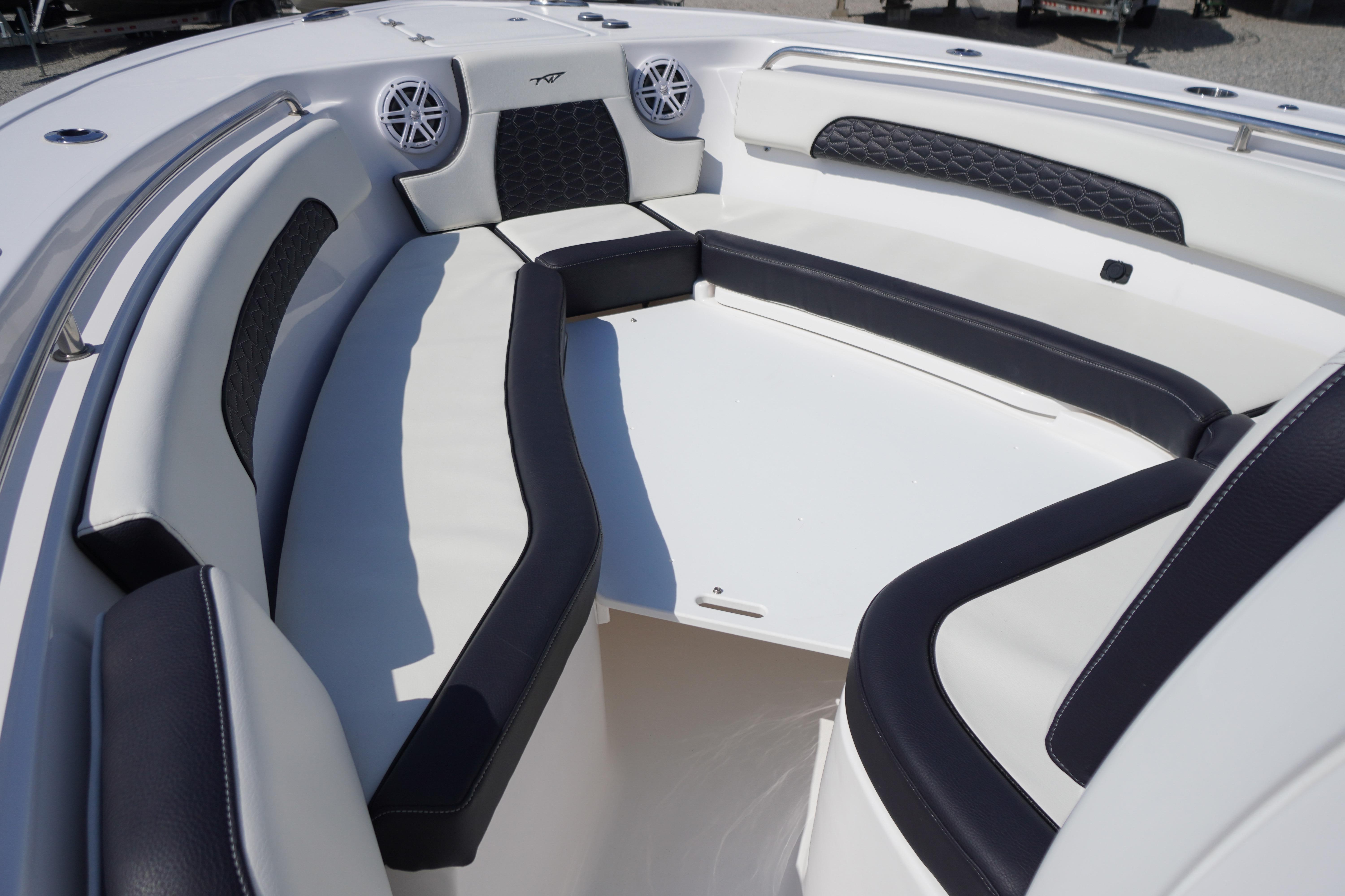 2025 Tidewater 232 SS boat interior with cushioned seating and modern design.