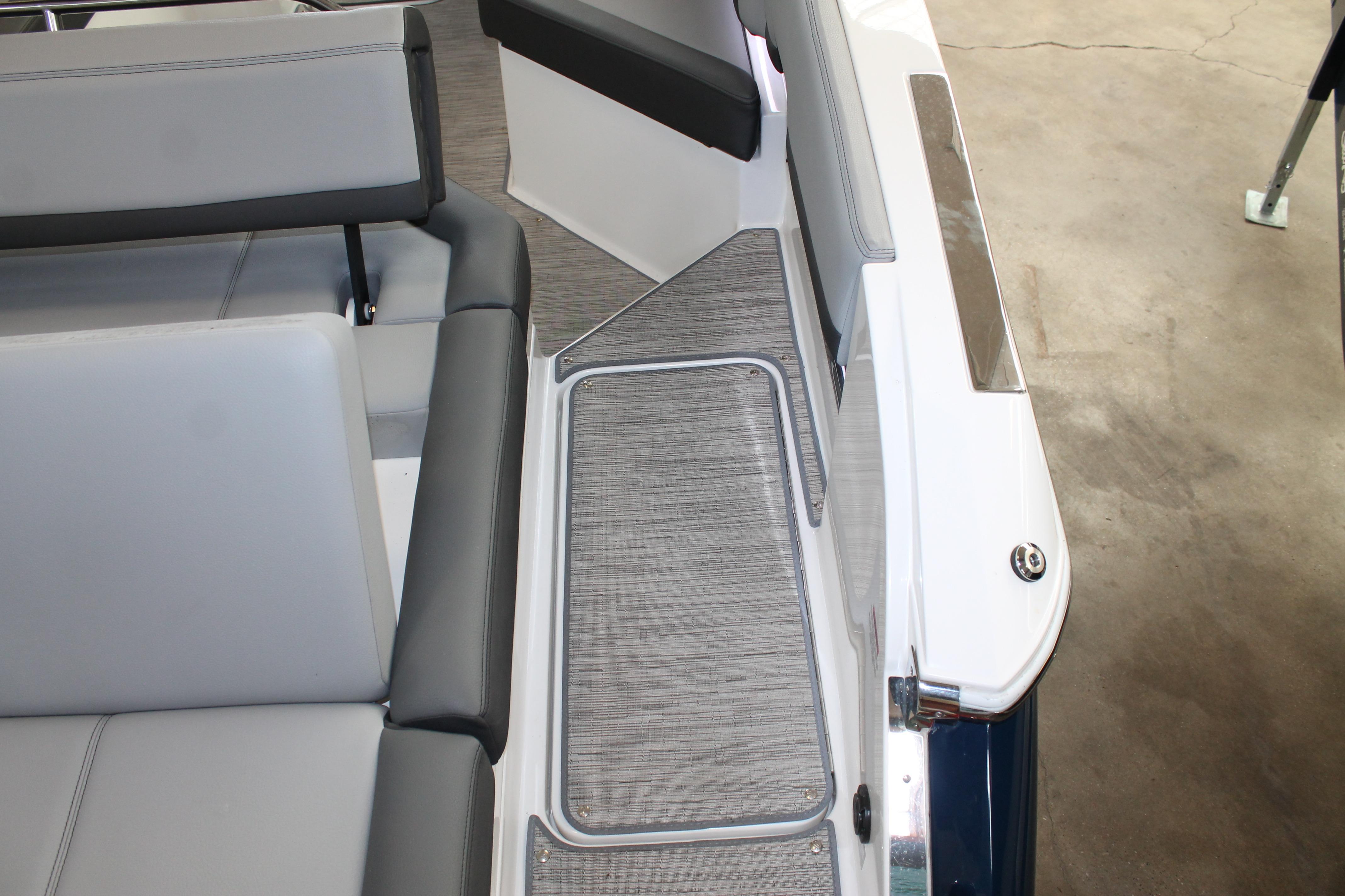 Interior view of 2023 Cobalt R8 boat with gray seating and flooring.