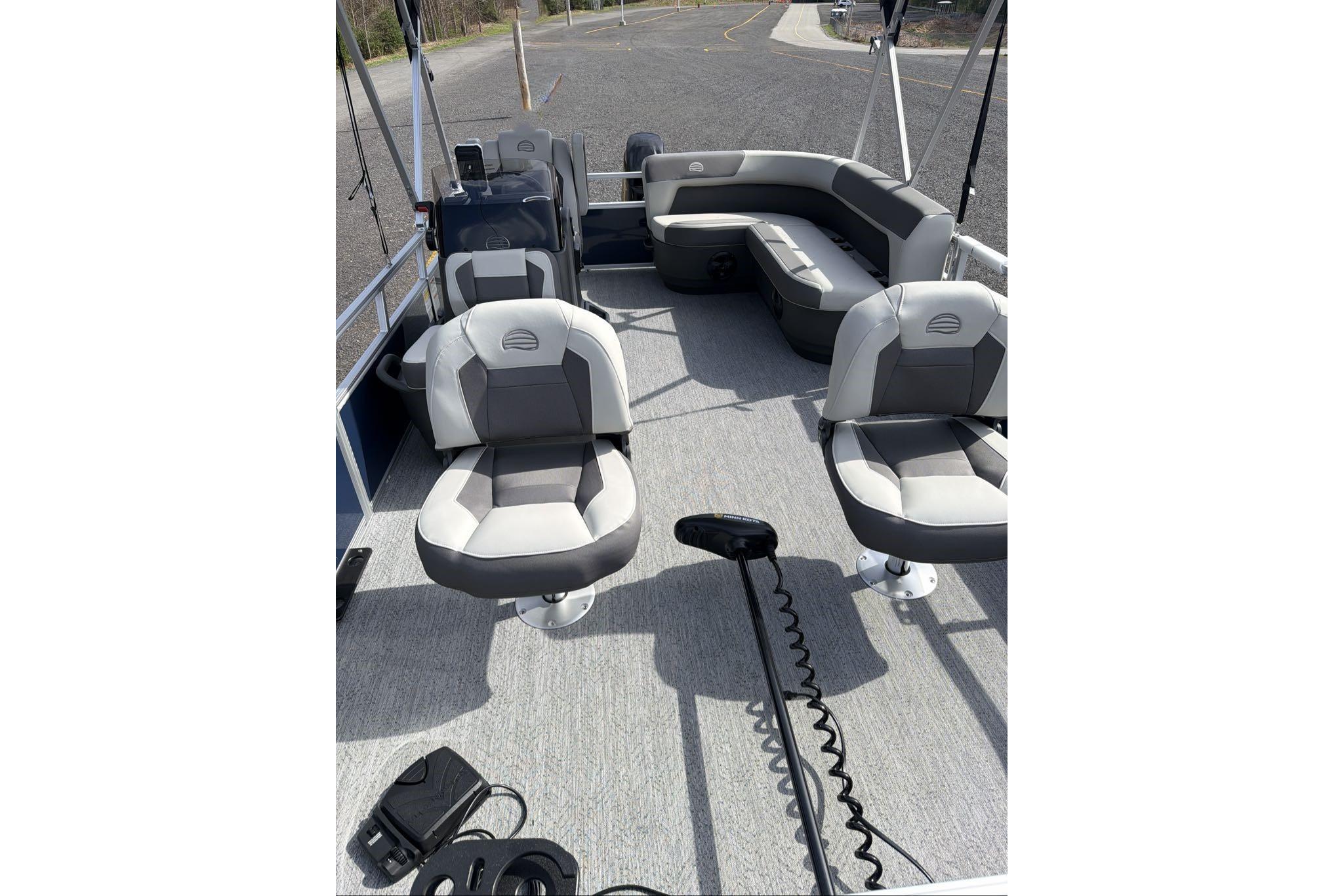 2026 Sun Tracker Bass Buggy 16 XL Select pontoon boat interior with seating and controls.
