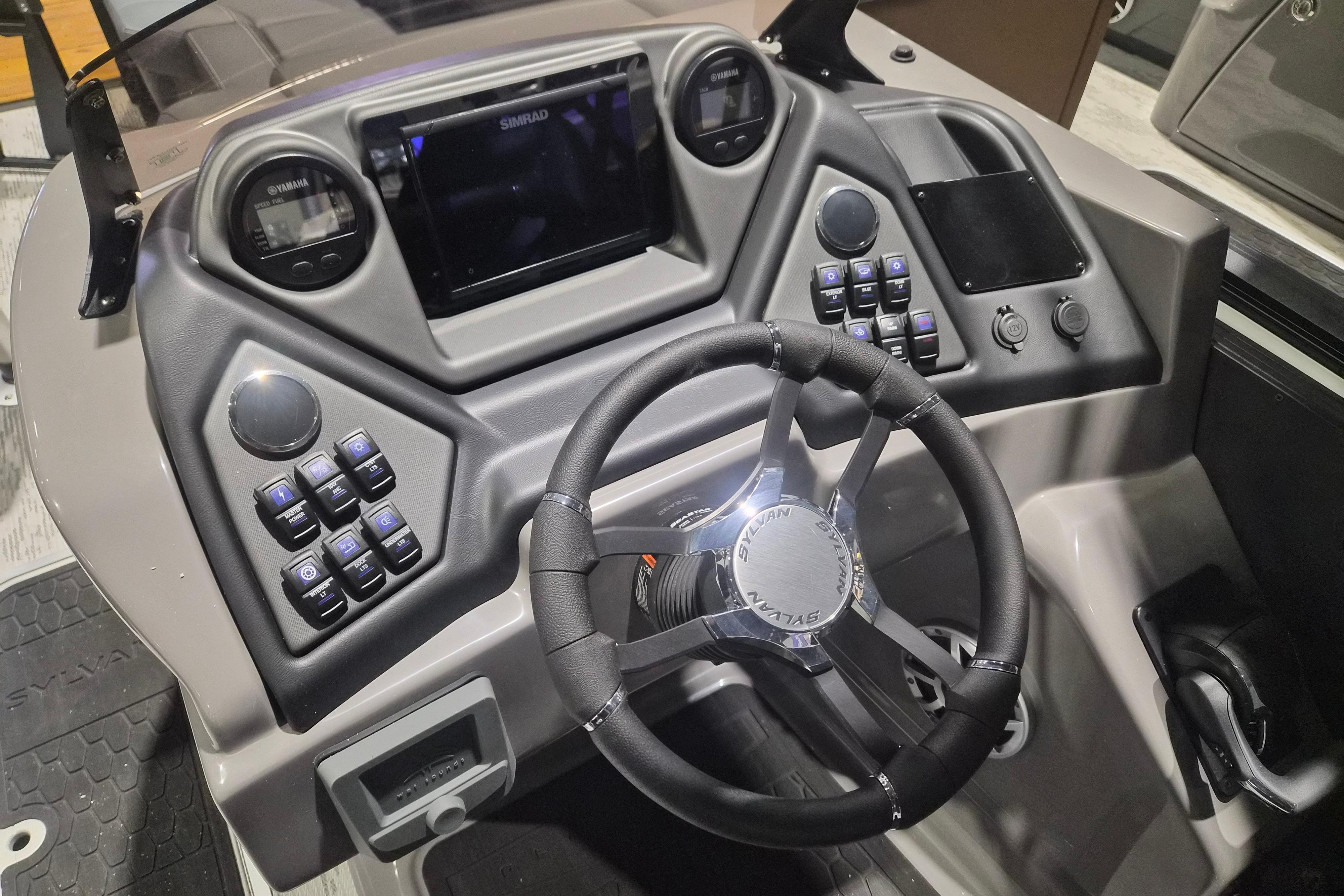 Steering console of 2026 Sylvan L3 ULZ boat with advanced controls and display.