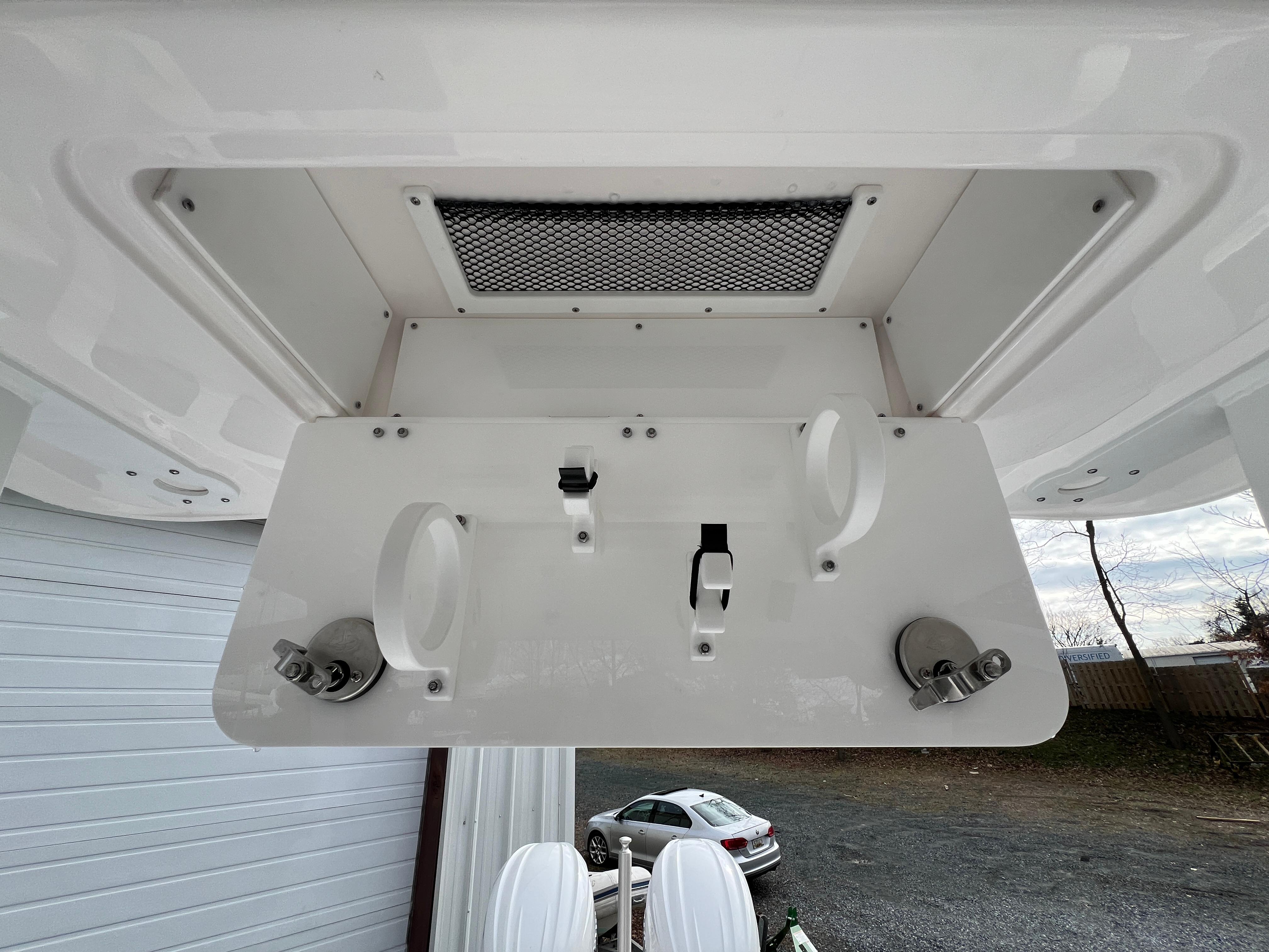 2024 Sea Fox 268 Traveler boat detail, featuring rod holders and storage compartment.
