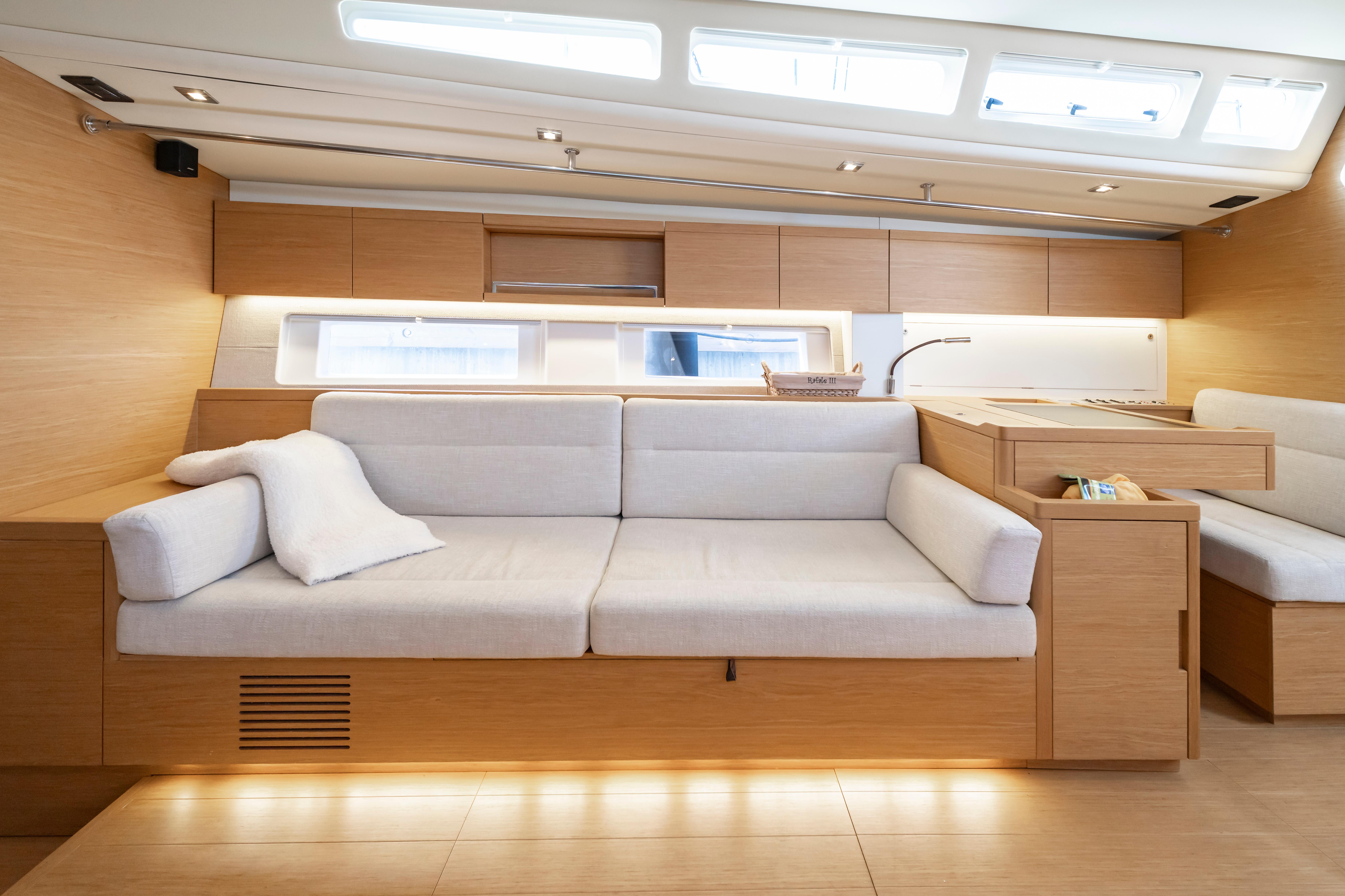 Luxurious interior of 2016 Grand Soleil 58 yacht with modern wood and white furnishings.