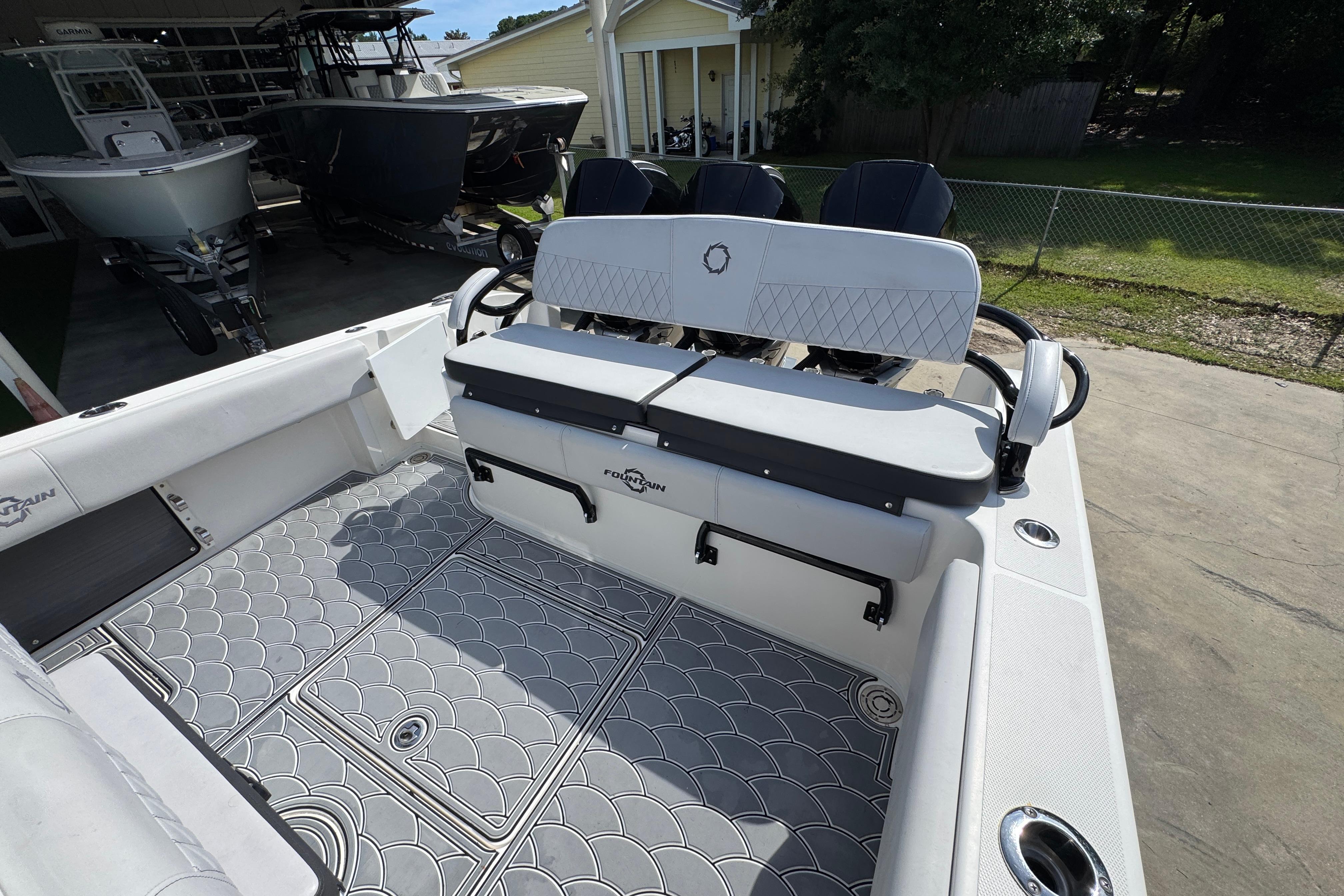 2023 Fountain 34 Tournament Edition boat interior with stylish seating and patterned flooring.