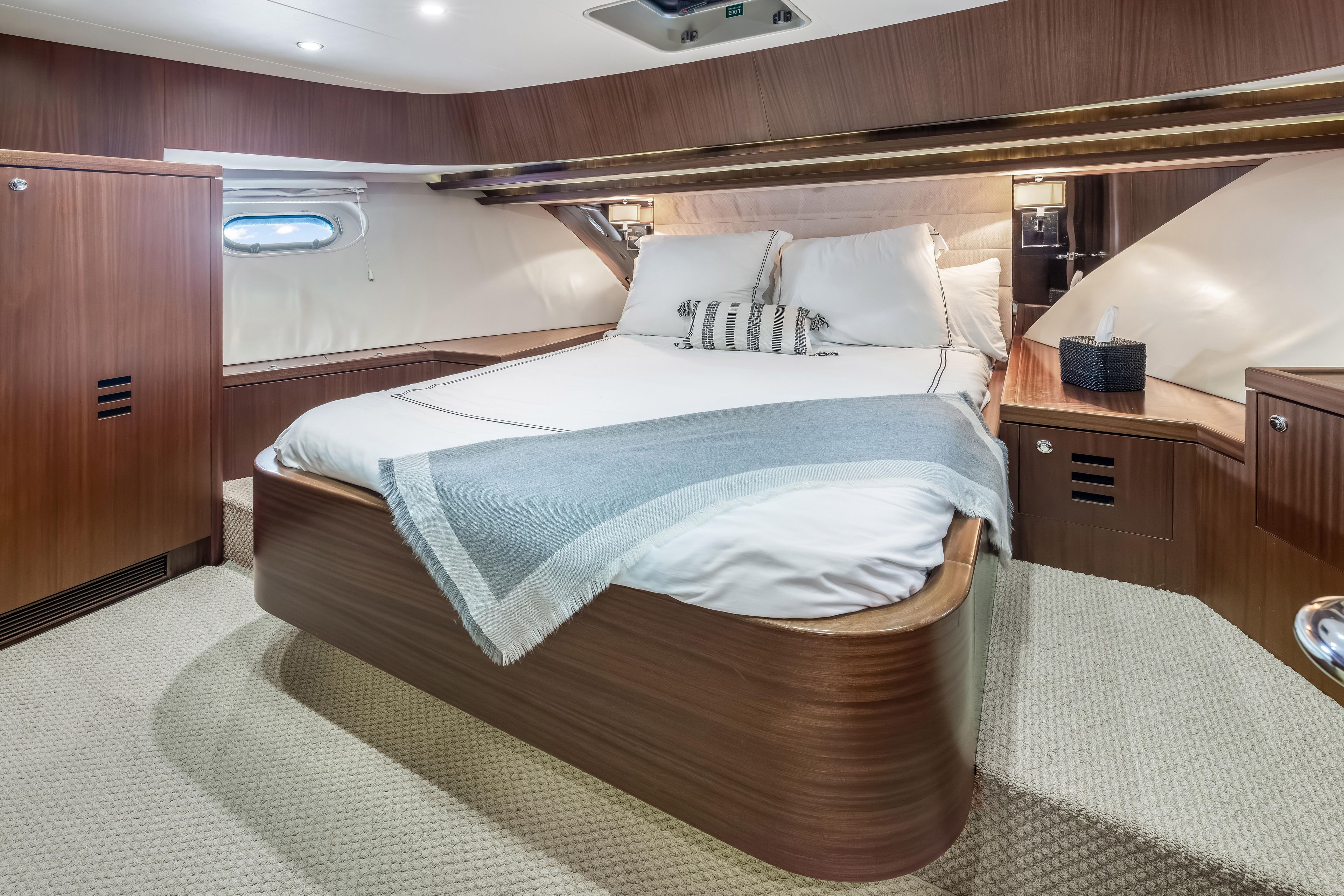 Luxurious bedroom interior of 2012 Cheoy Lee 84 Bravo yacht with elegant wood finish.