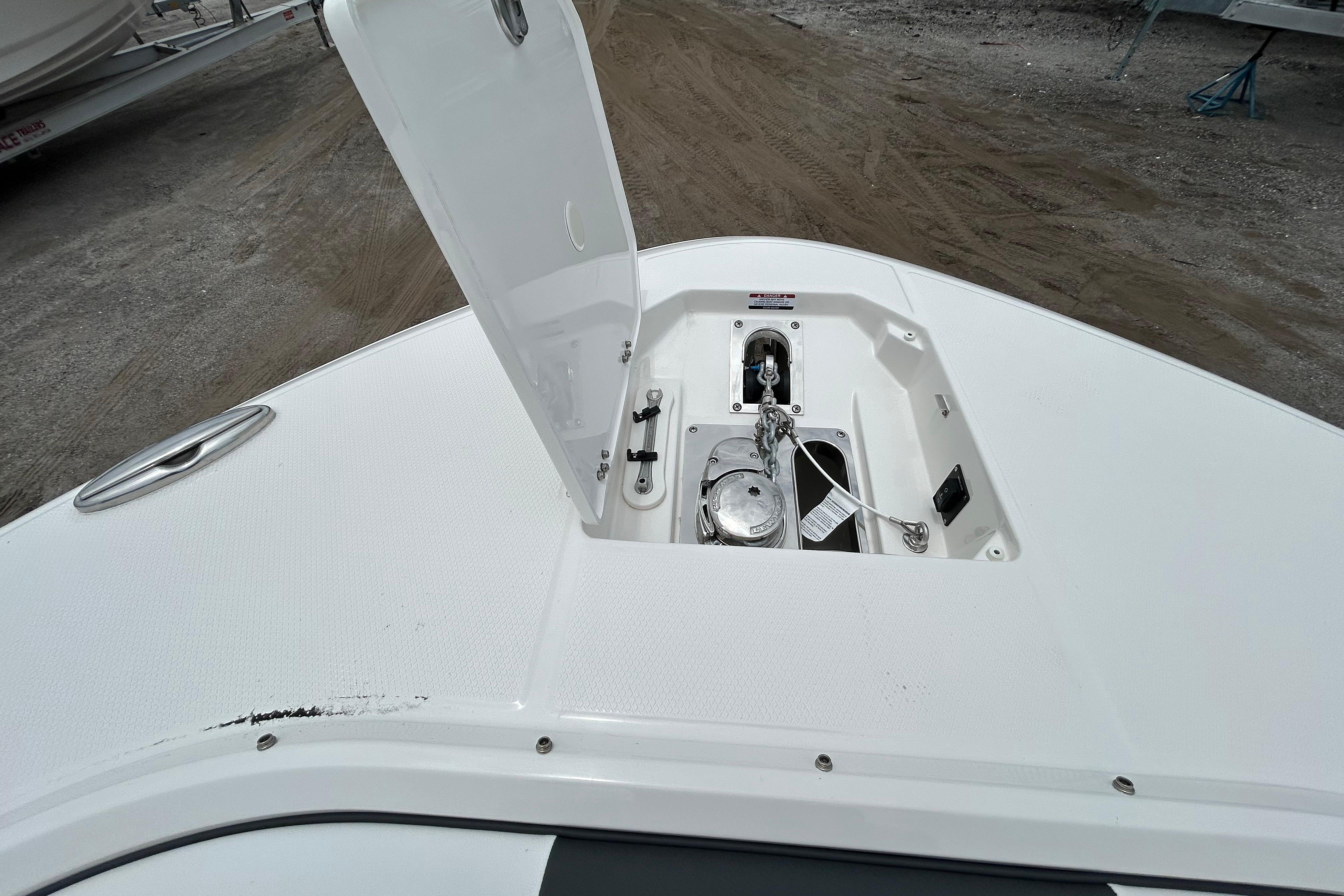 2026 Robalo R277 Dual Console boat anchor compartment with open hatch.