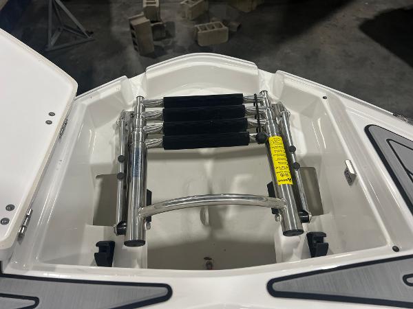 2024 Monterey M4 boat ladder compartment with stainless steel retractable ladder.