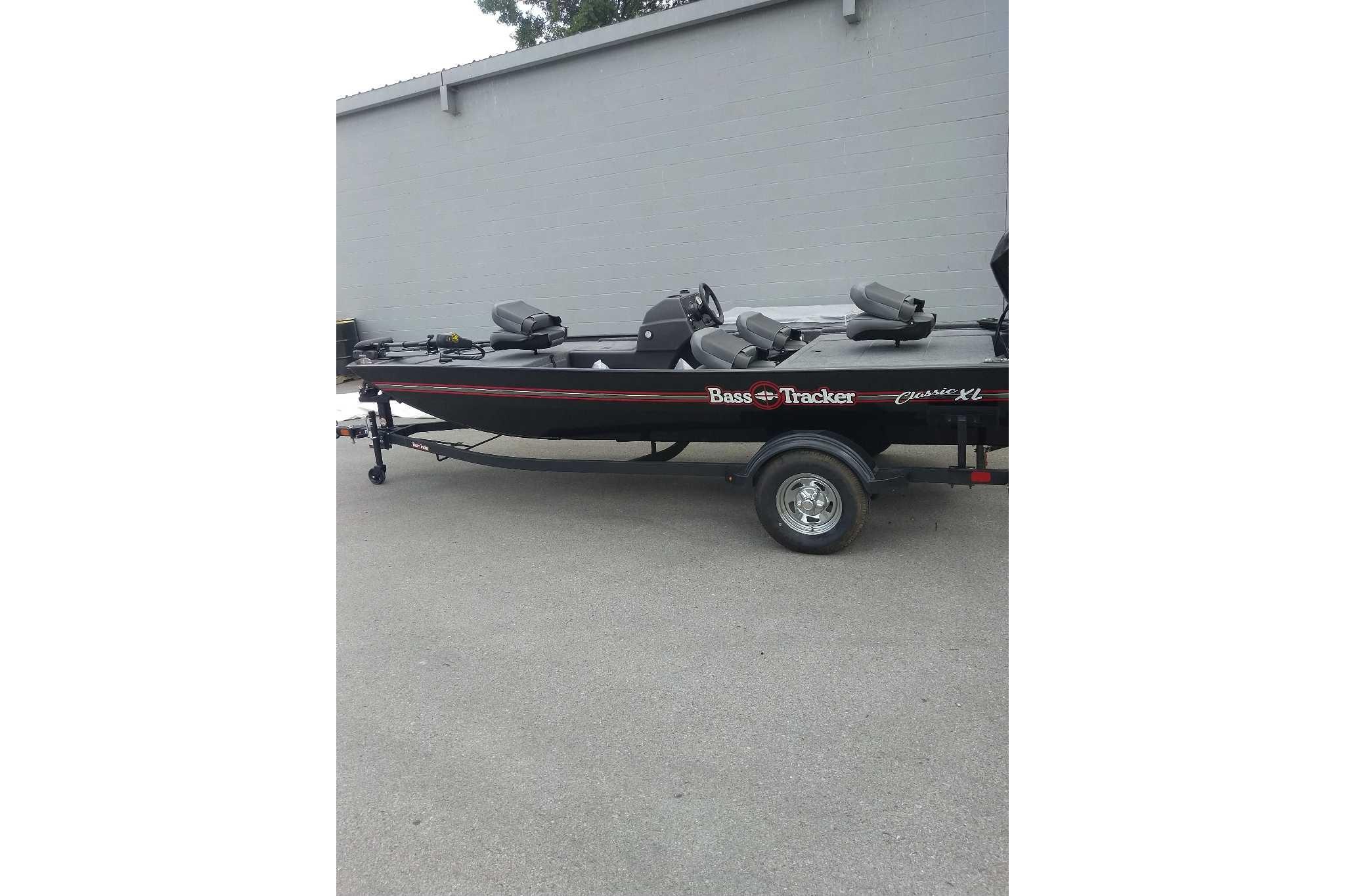 2026 Tracker Bass Tracker Classic XL boat on trailer, parked outdoors.