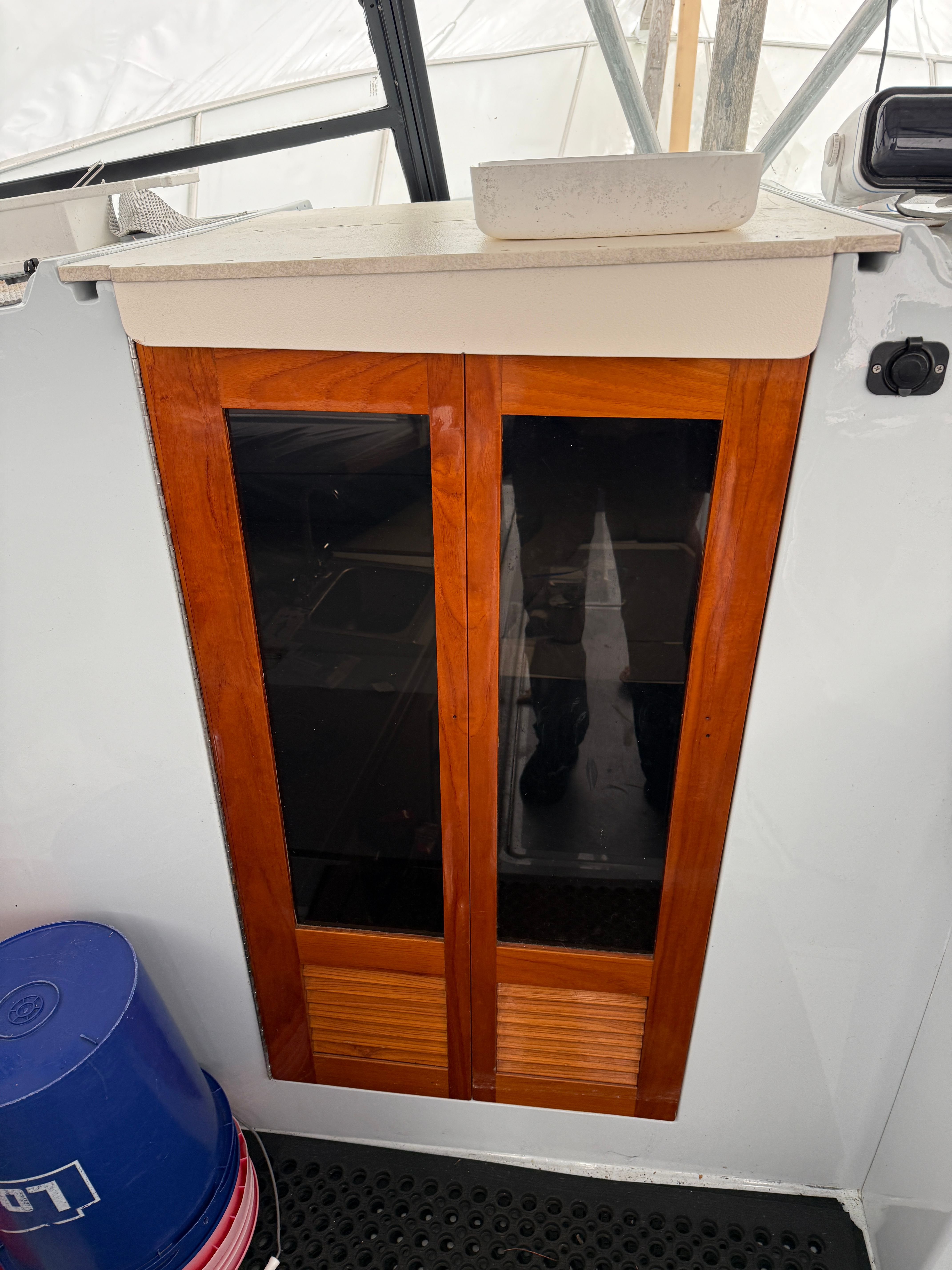 Wooden doors on a 1989 Black Watch Custom 35 boat.