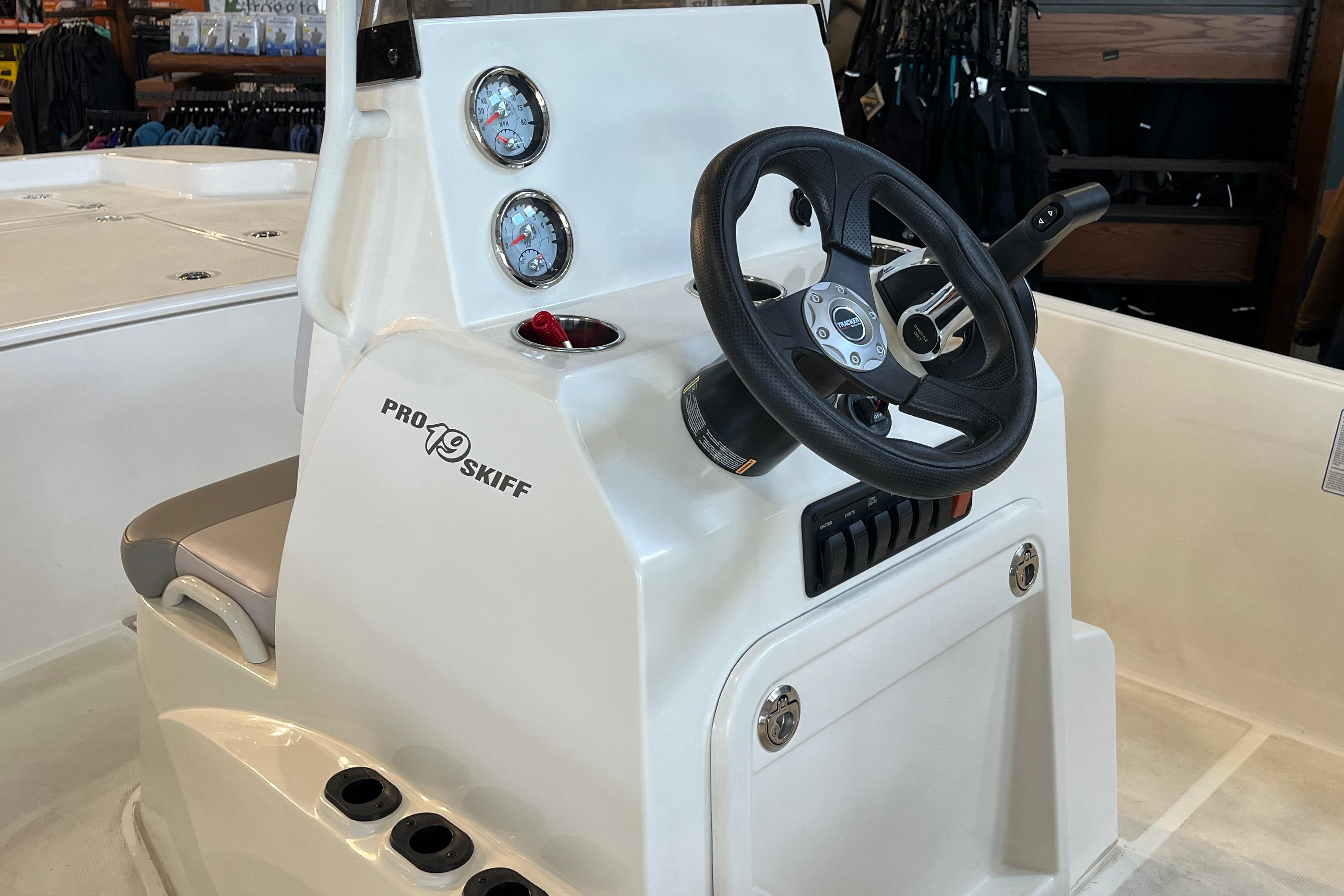 2024 Mako Pro Skiff 19 CC boat console with steering wheel and gauges.
