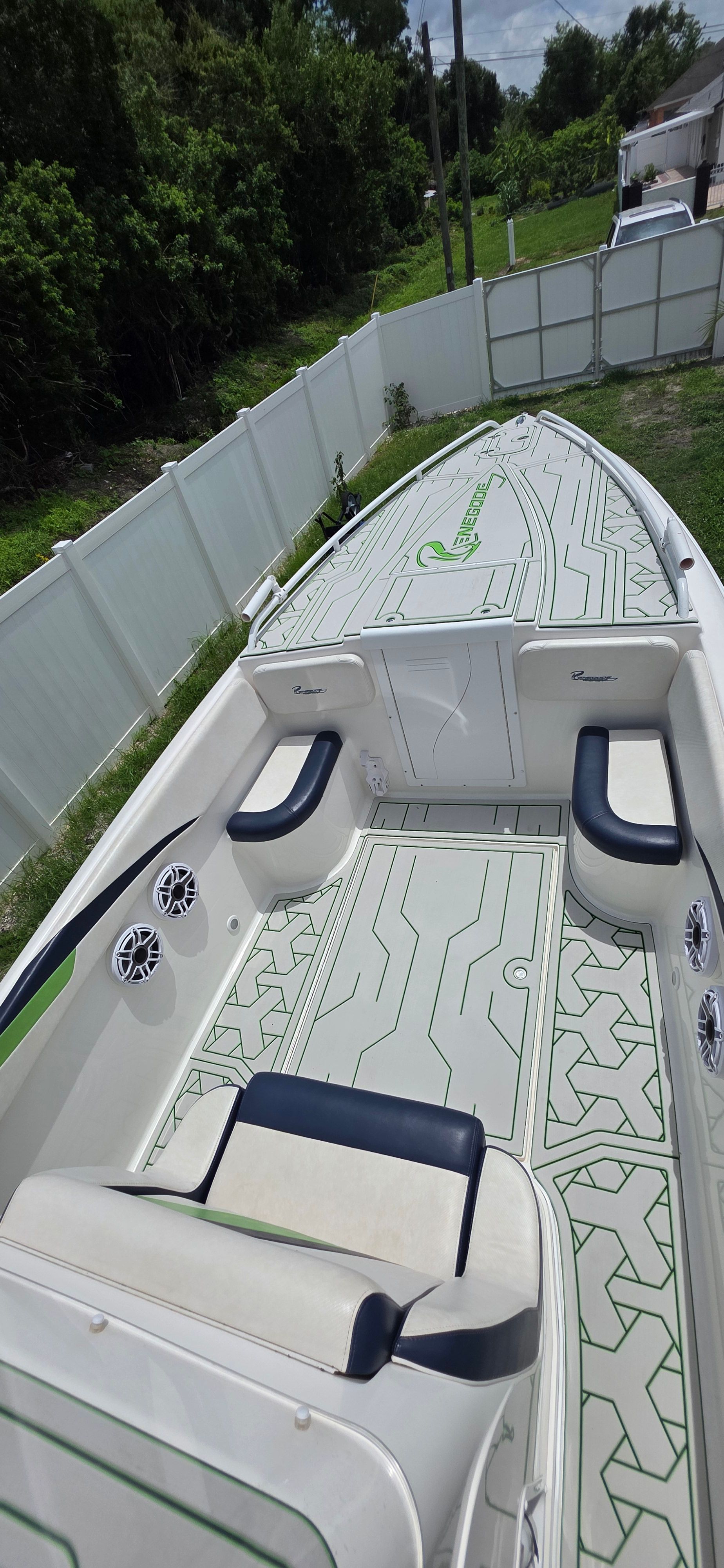 2013 Renegade 32 FT boat with sleek design and comfortable seating.