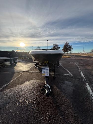 2023 Tahoe T16 boat in parking lot at sunrise.