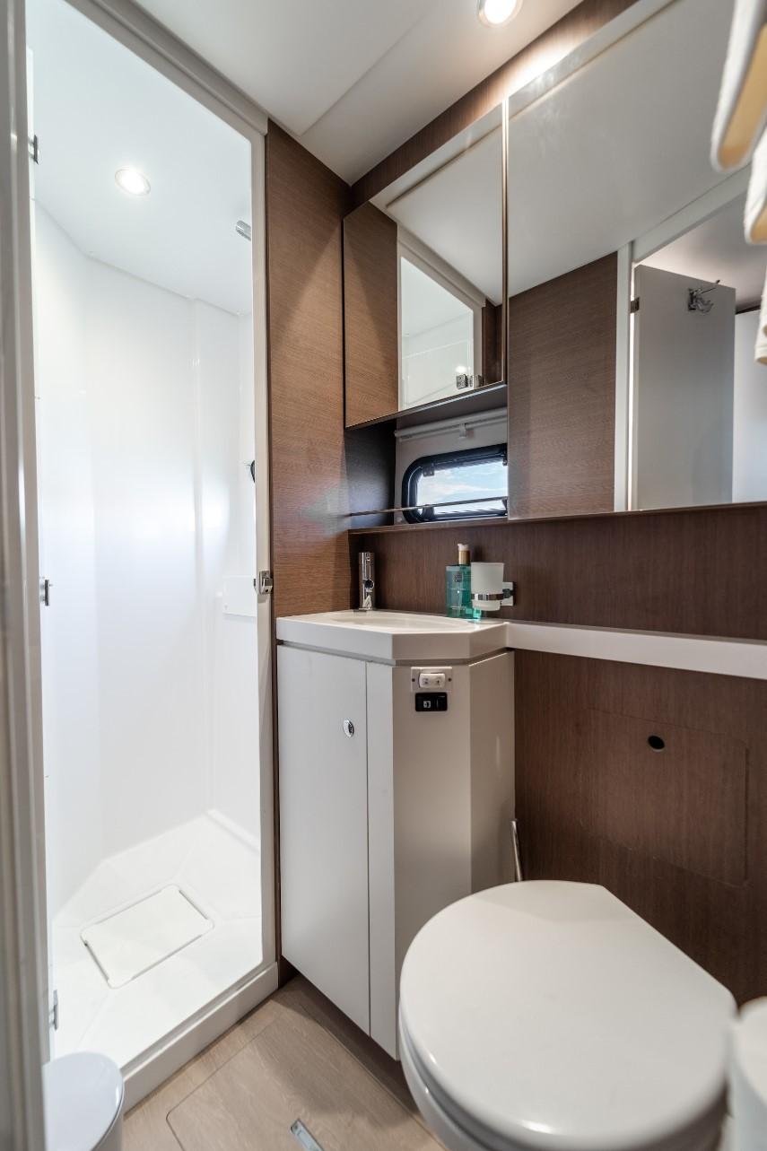 Modern bathroom in 2021 Bali 5.4 Open Space yacht with shower and sleek design.