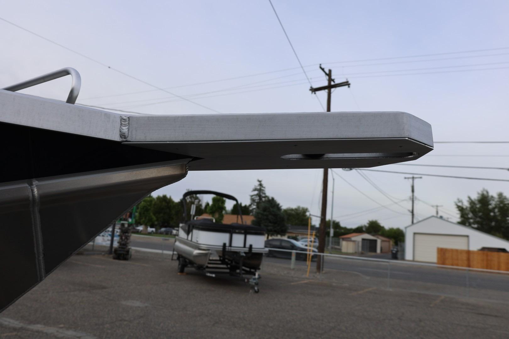 Close-up of 2026 Thunder Jet 24 Alexis Pro boat detail in a parking lot.