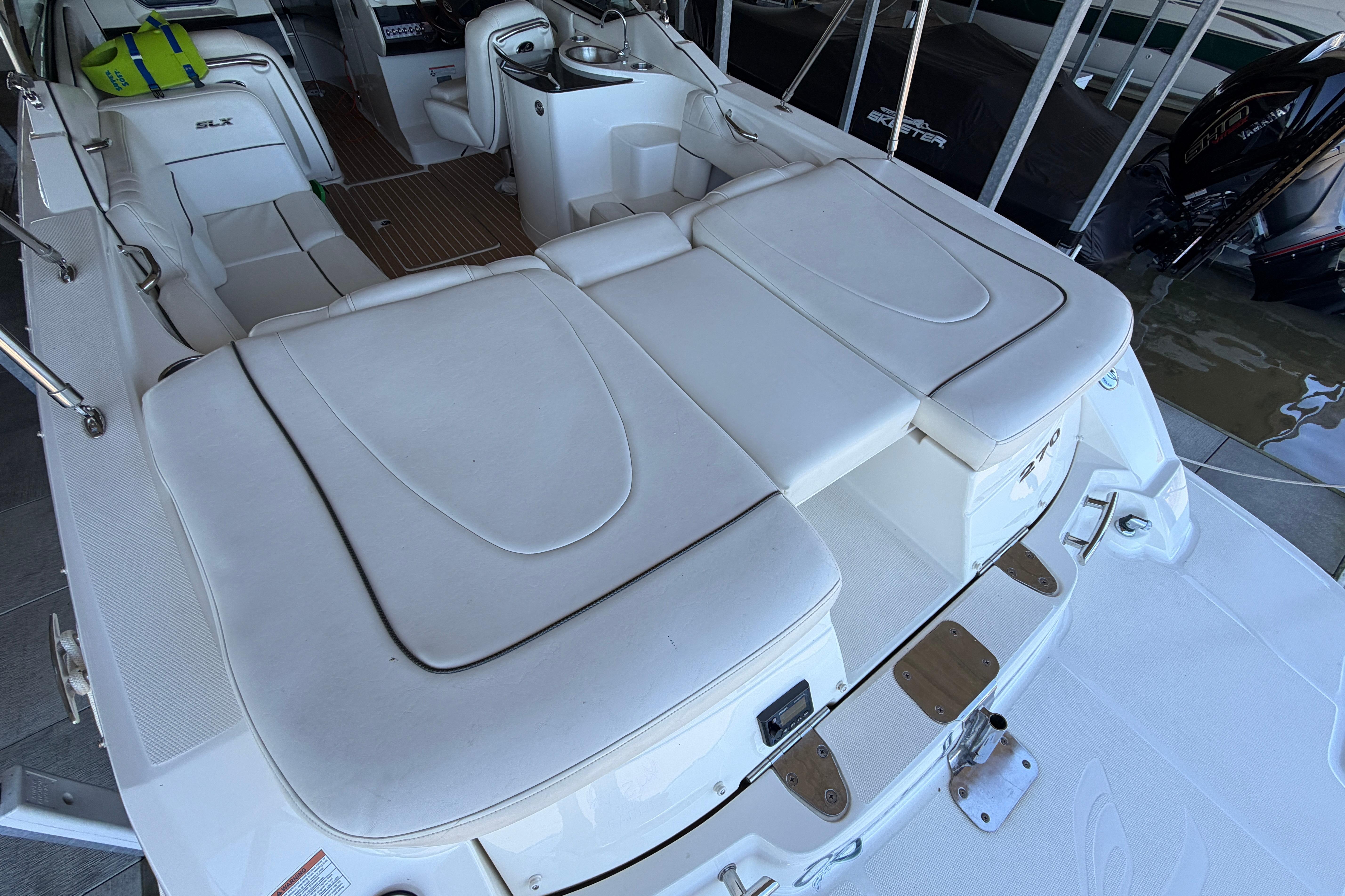 2007 Sea Ray 270 SLX boat interior with white seating and deck details.