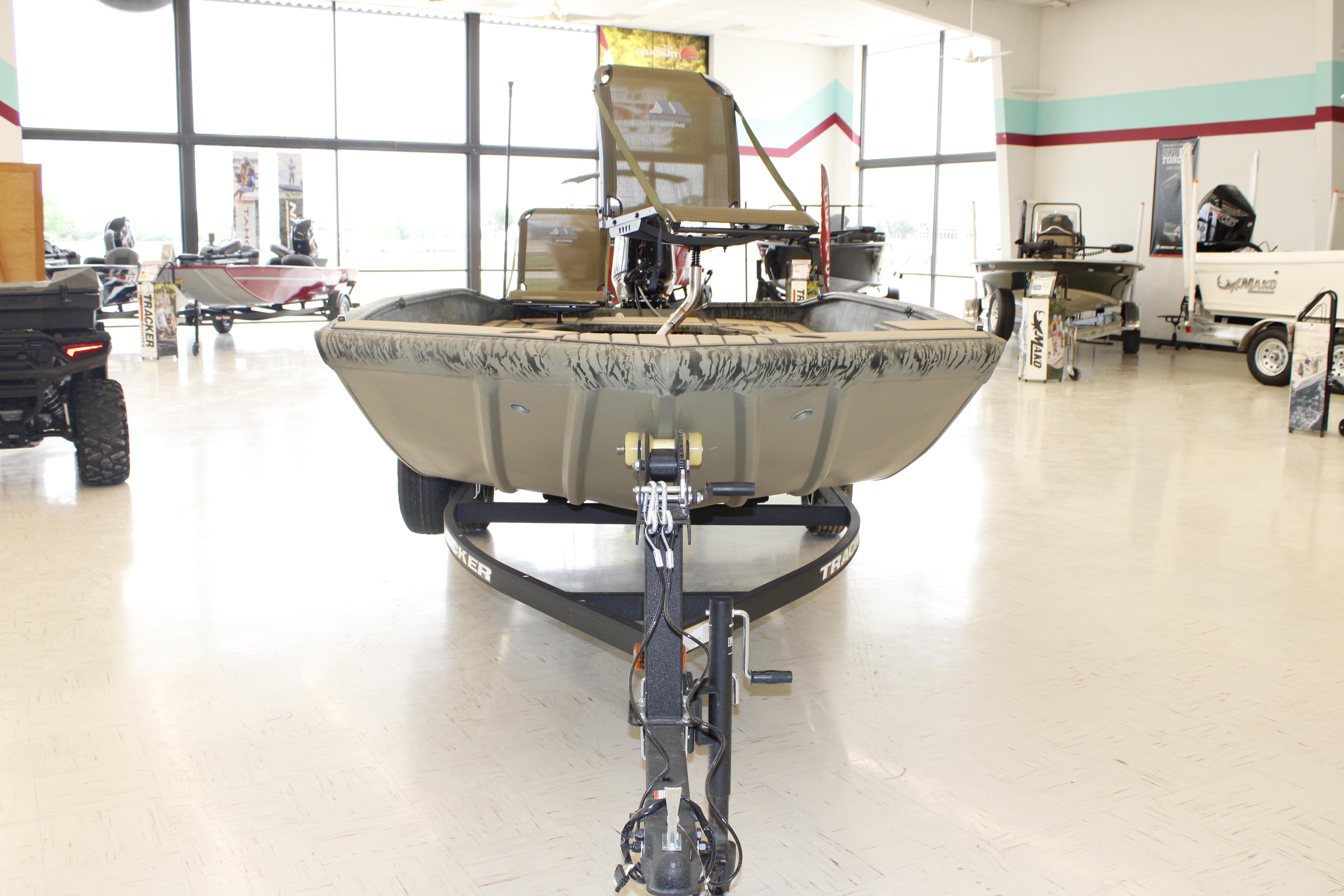 2026 Tracker Grizzly 1756 T Marsh boat displayed in showroom on trailer.