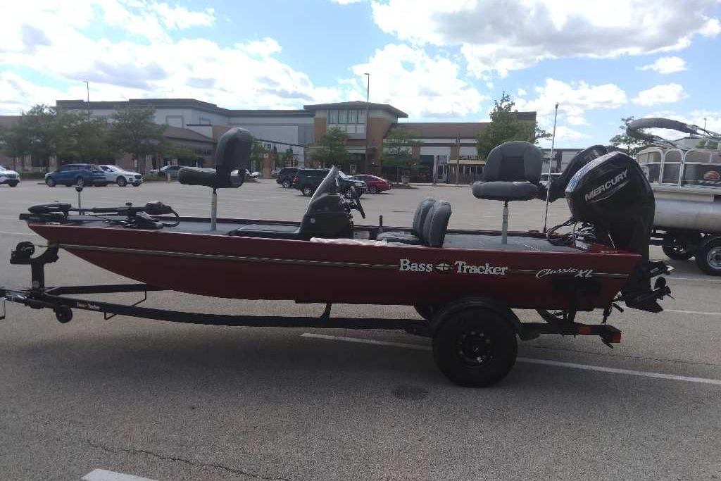 2026 Tracker Bass Tracker Classic XL boat in parking lot, side view.