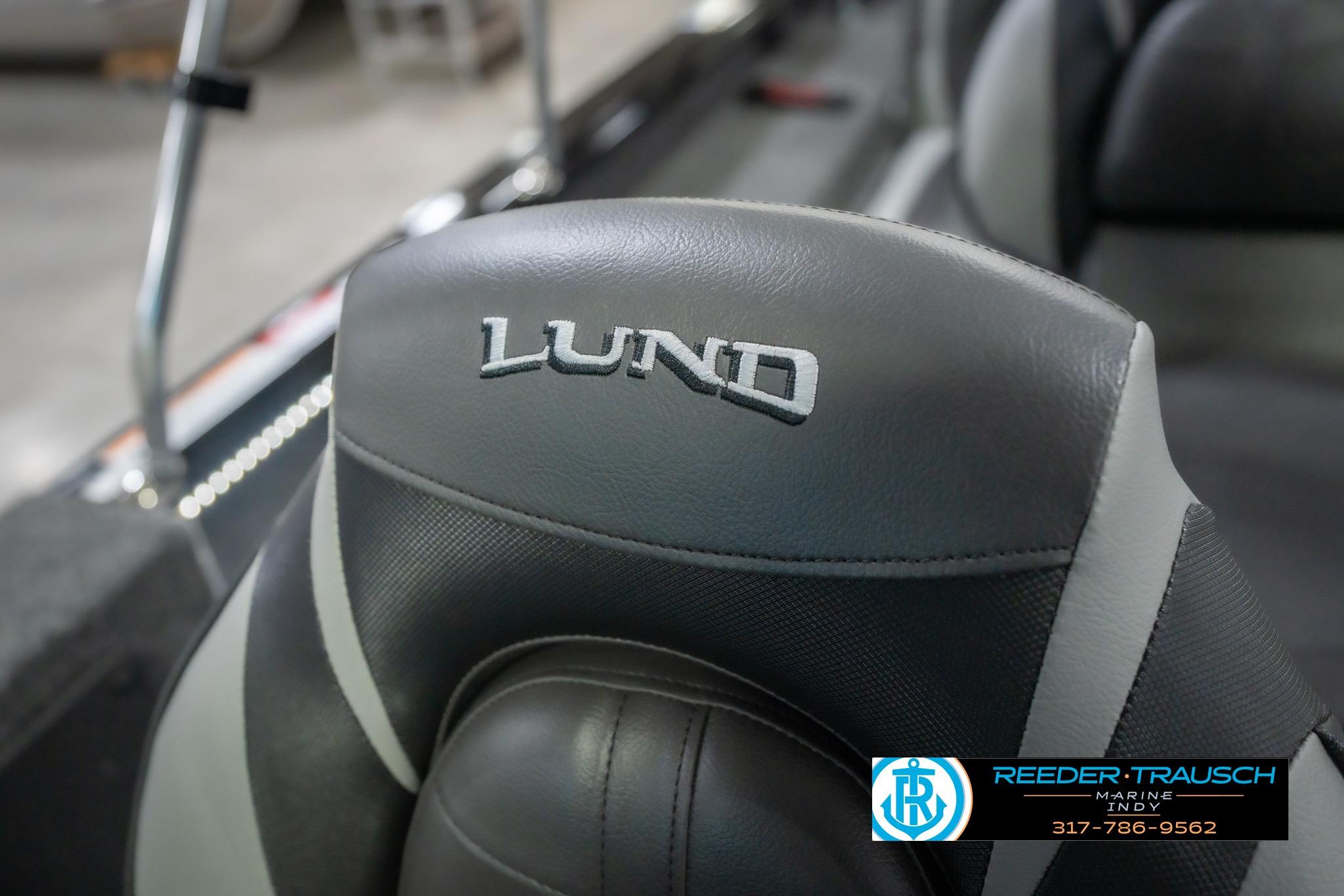 2026 Lund 2075 Impact XS boat seat with logo, featuring sleek gray upholstery.