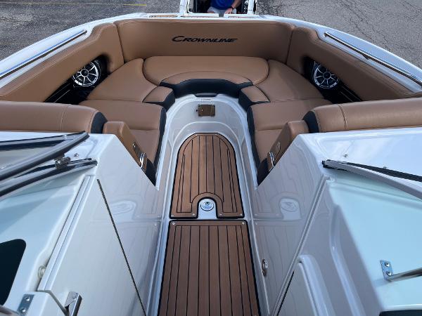 2024 Crownline Eclipse E255 boat interior with tan seating and wood accents.