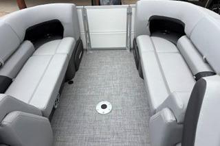 2026 Sun Tracker Party Barge 22 XP3 interior with gray seating and spacious layout.