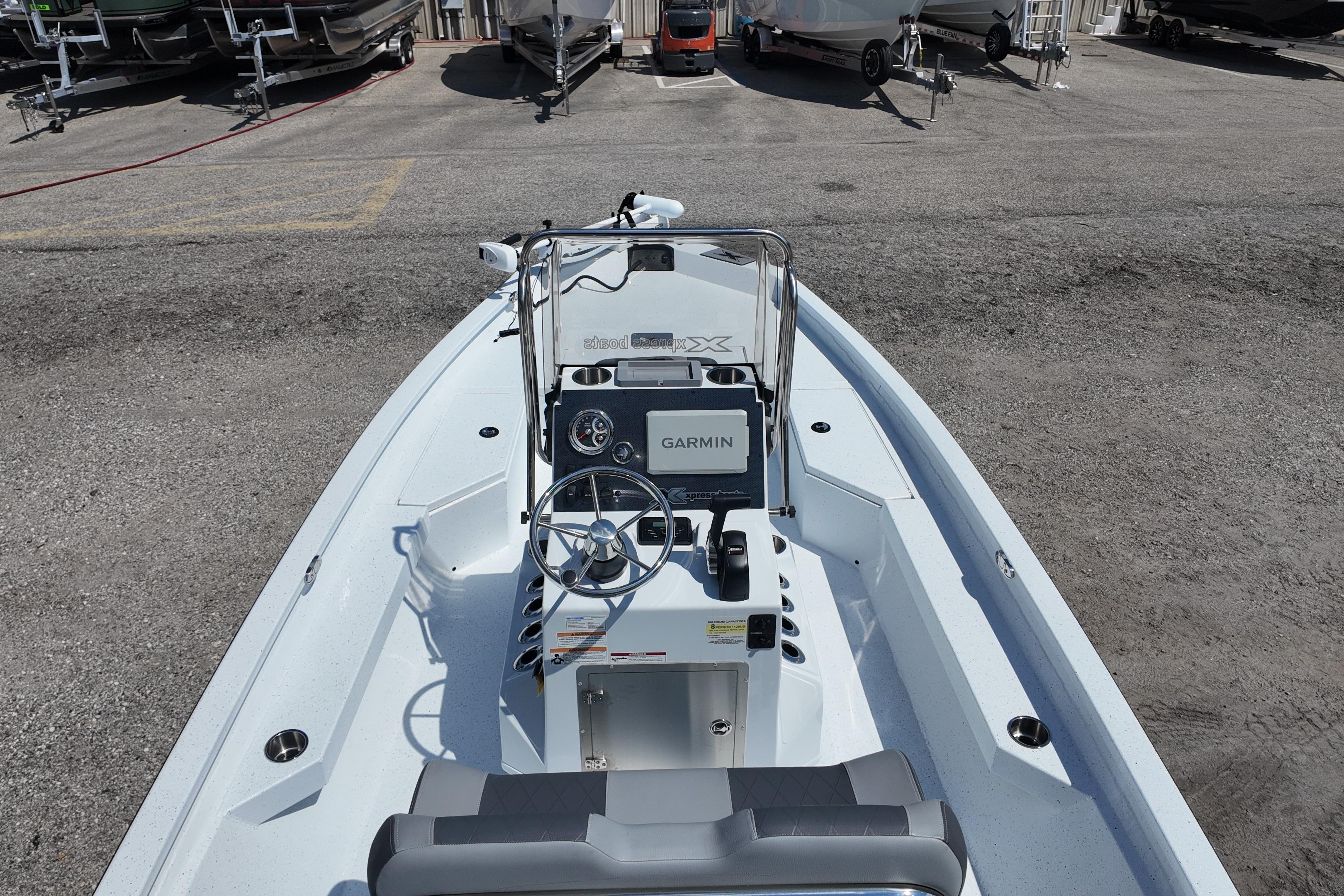 2026 Xpress H20 boat with Garmin navigation, parked in a marina.