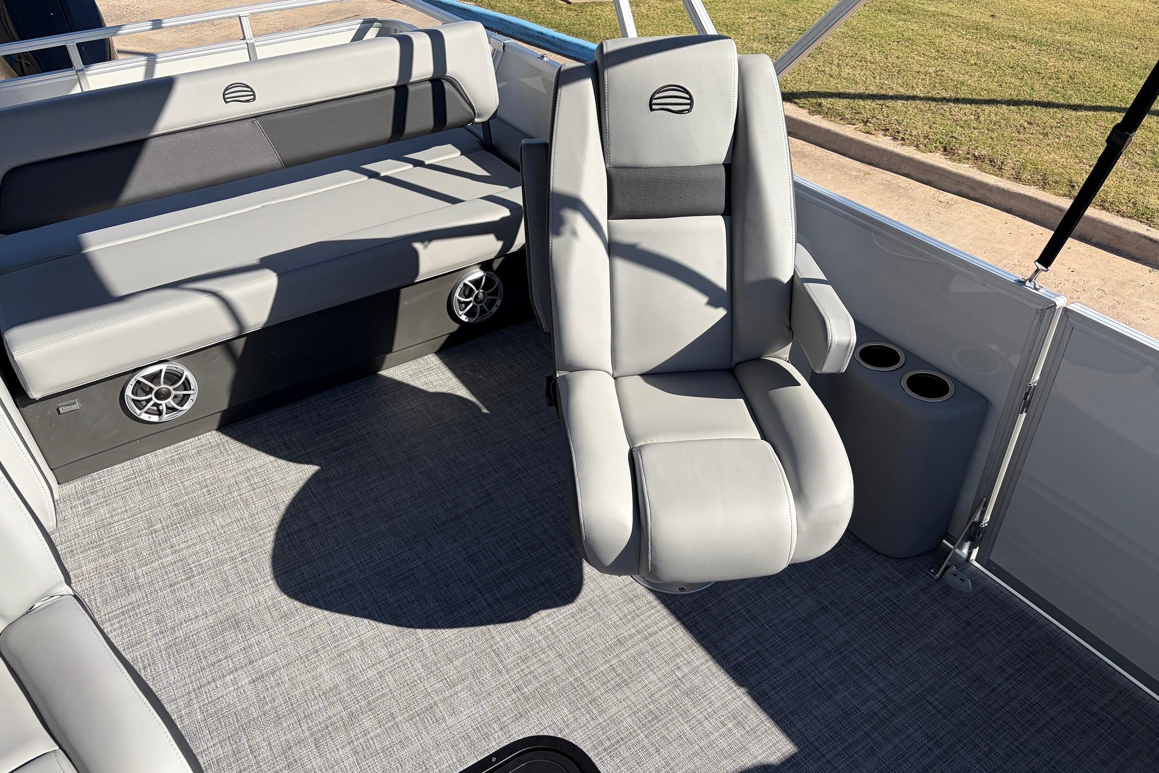 2026 Sun Tracker Party Barge 22 RF XP3 interior with gray seating and cup holders.