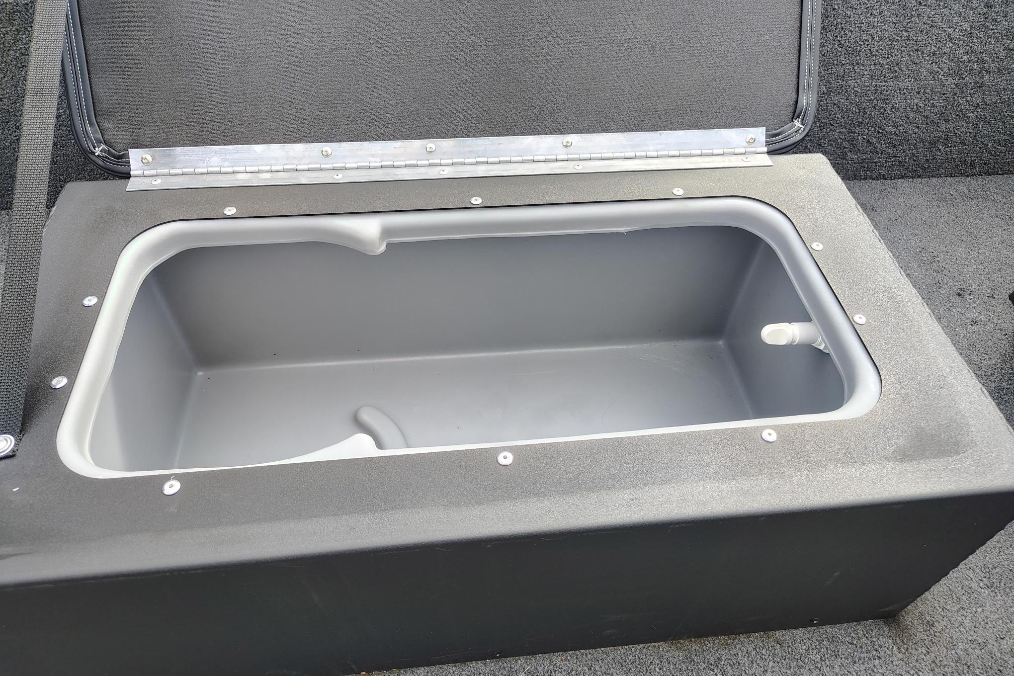 Livewell compartment in 2025 Tracker Panfish 17 boat, open lid, gray interior.