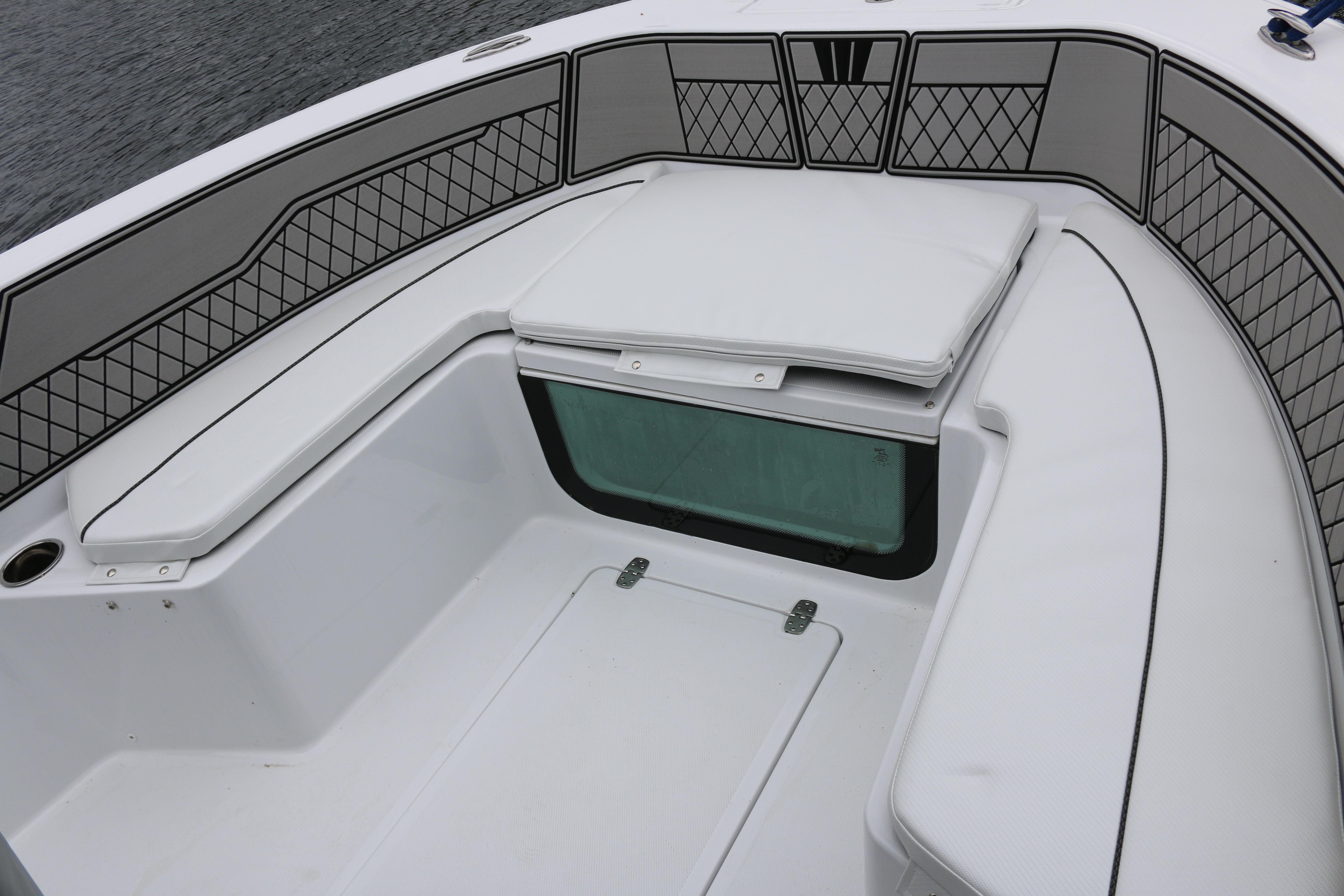 2025 Wellcraft 202 Fisherman boat interior with cushioned seating and storage compartments.