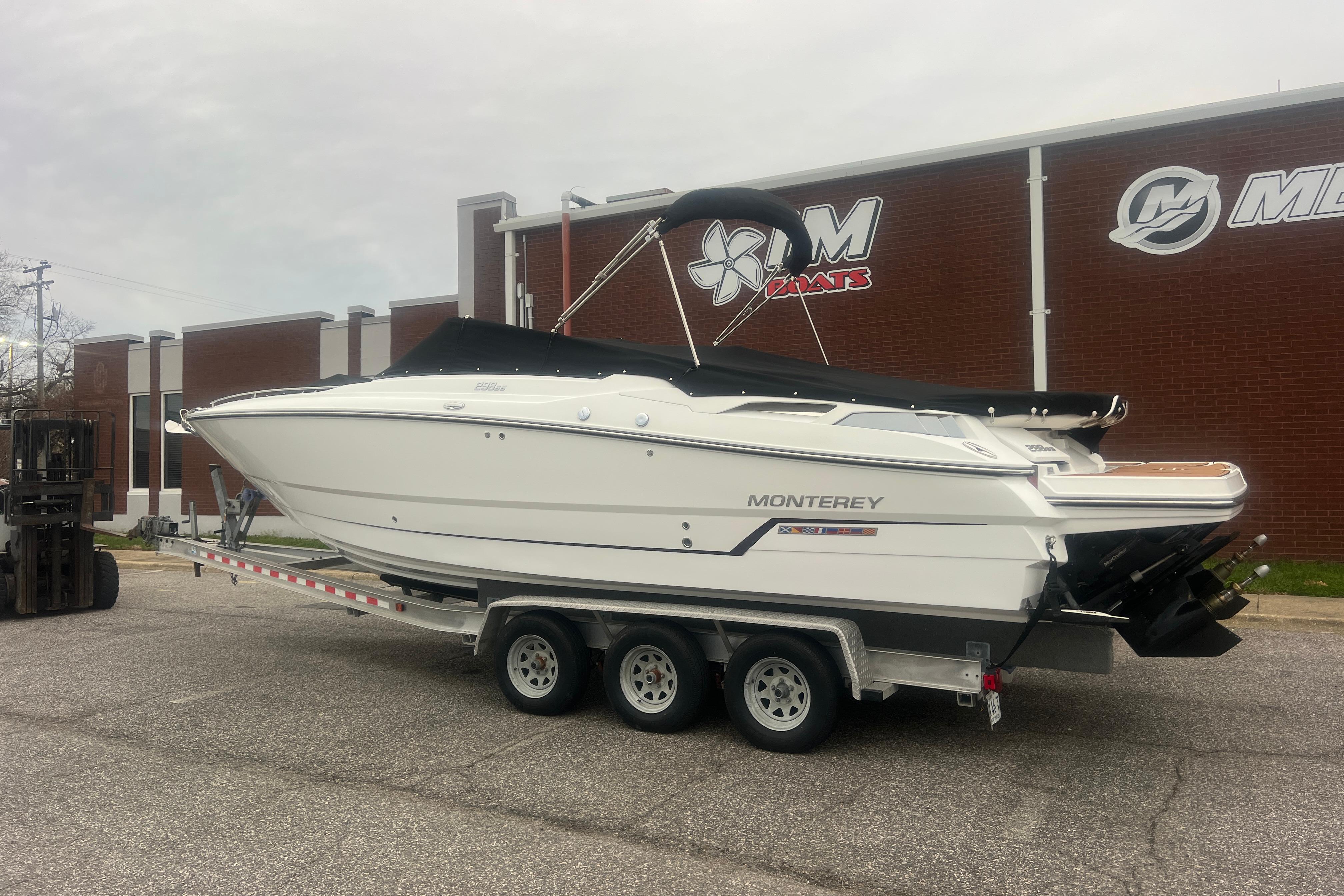 2017 Monterey 298SS Super Sport boat on trailer outside dealership.