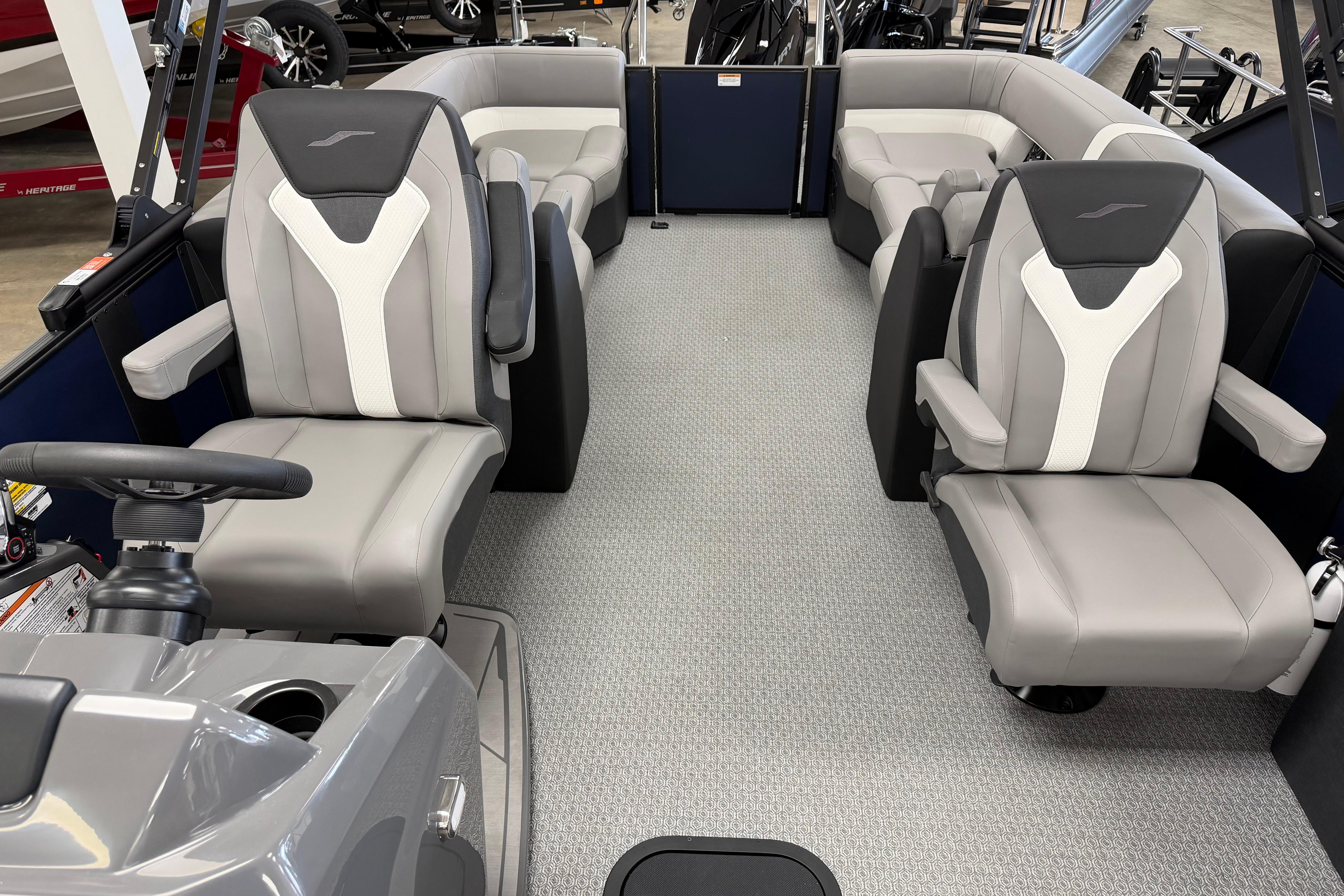 Interior of 2026 Evotti 523QL boat with modern seating and steering console.
