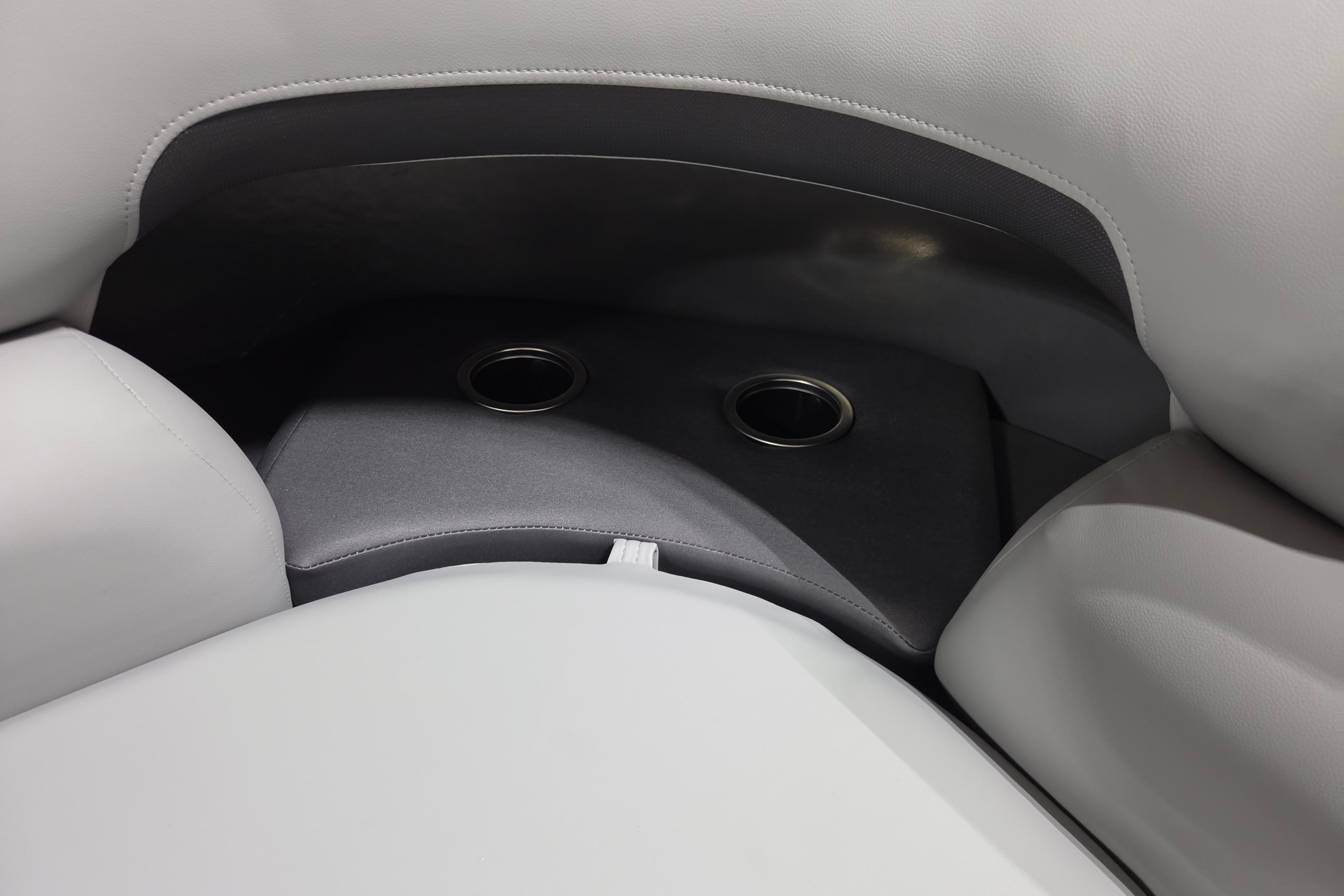 2026 Sun Tracker Party Barge 20 DLX interior with dual cup holders.