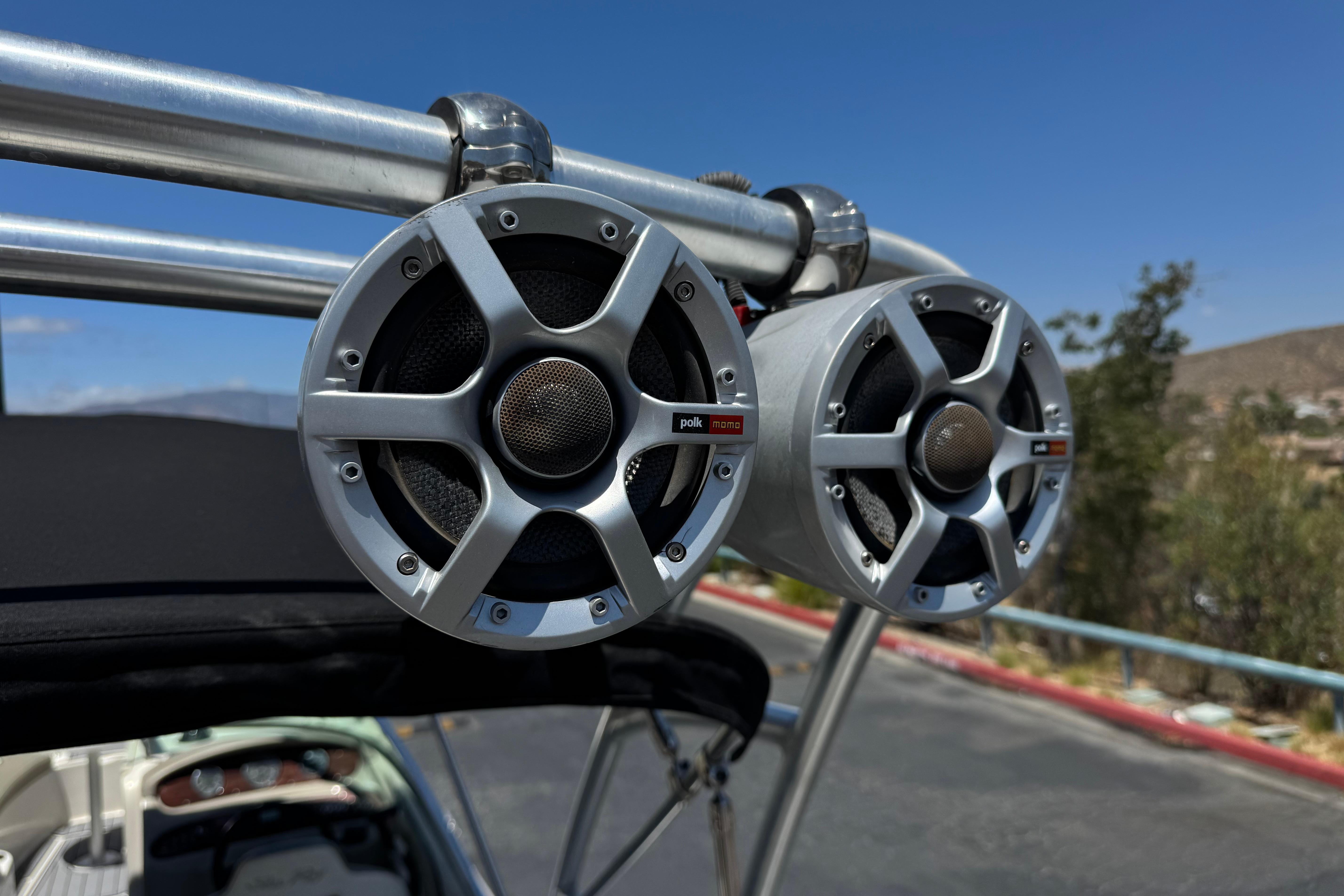 Speakers on a 2007 Sea Ray 240 Sundeck boat, clear sky background.