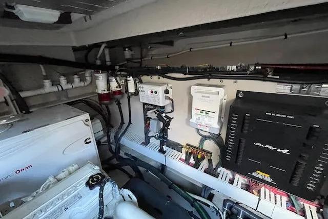 Engine room of 2016 Sea Ray Sundancer 510 yacht, showcasing electrical systems and components.