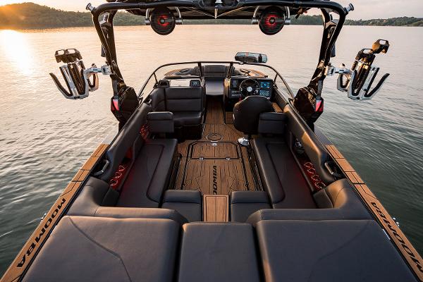 Manufacturer Provided Image: 2025 Moomba Mojo boat interior with sleek seating and advanced dashboard on a serene lake.