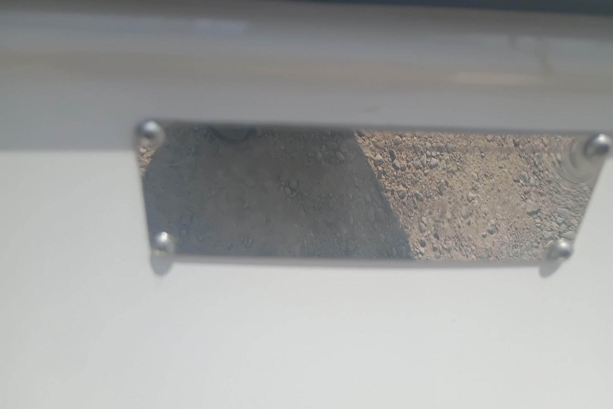 Close-up of a metal plate on a 2024 iKon LX21 vehicle.