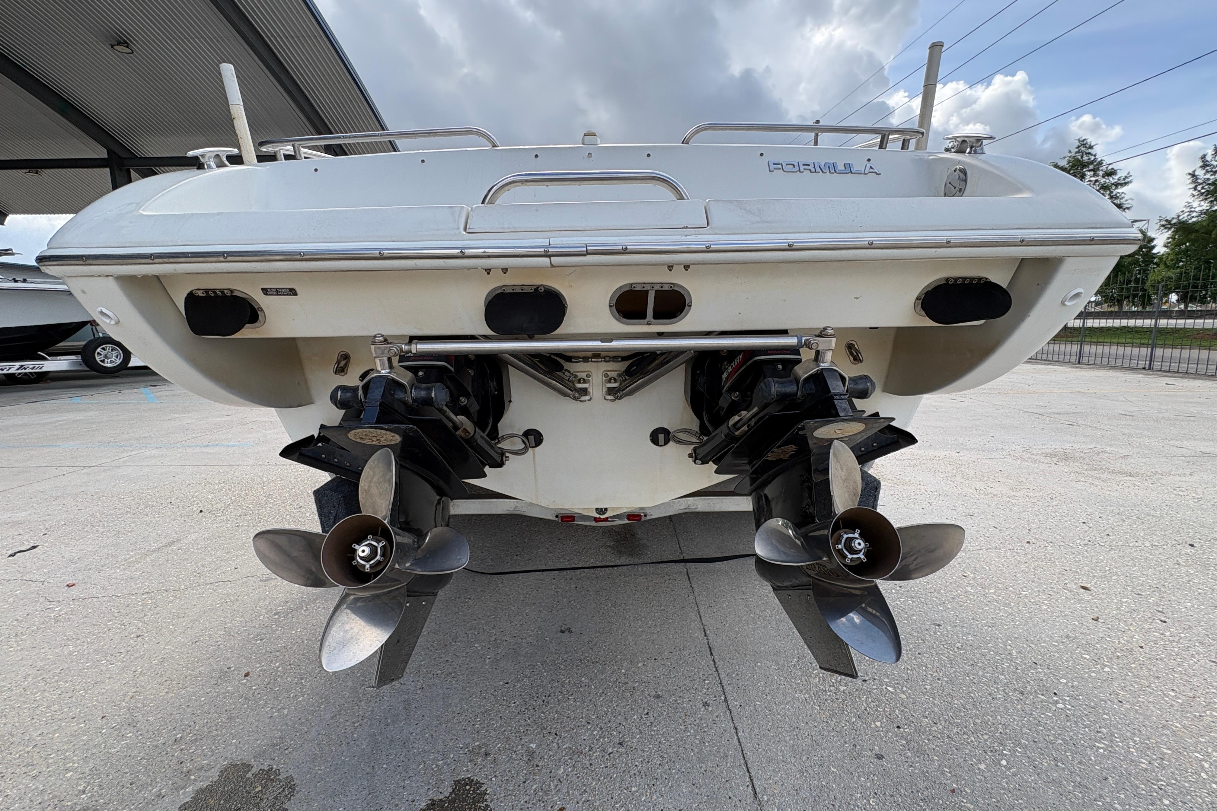 Rear view of a 2002 Formula 292 FASTech boat with dual propellers.