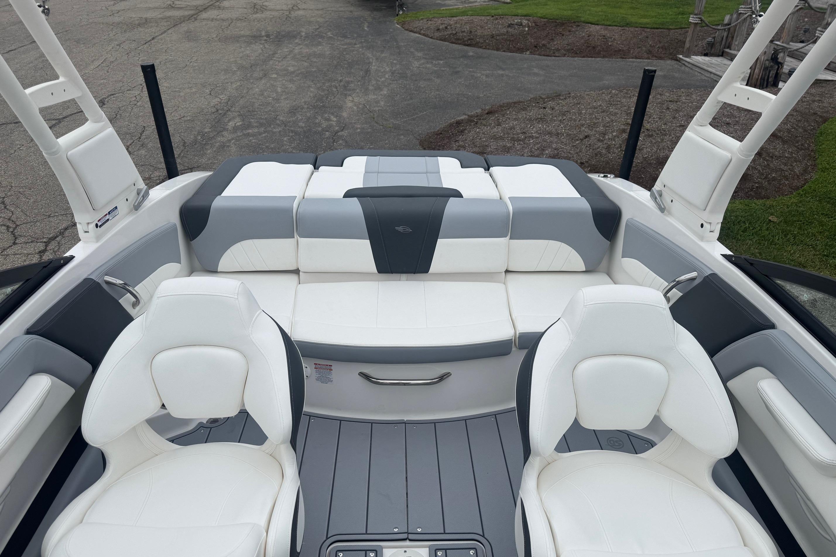 2026 Chaparral 21 SSi boat interior with white and gray seating, sleek design.