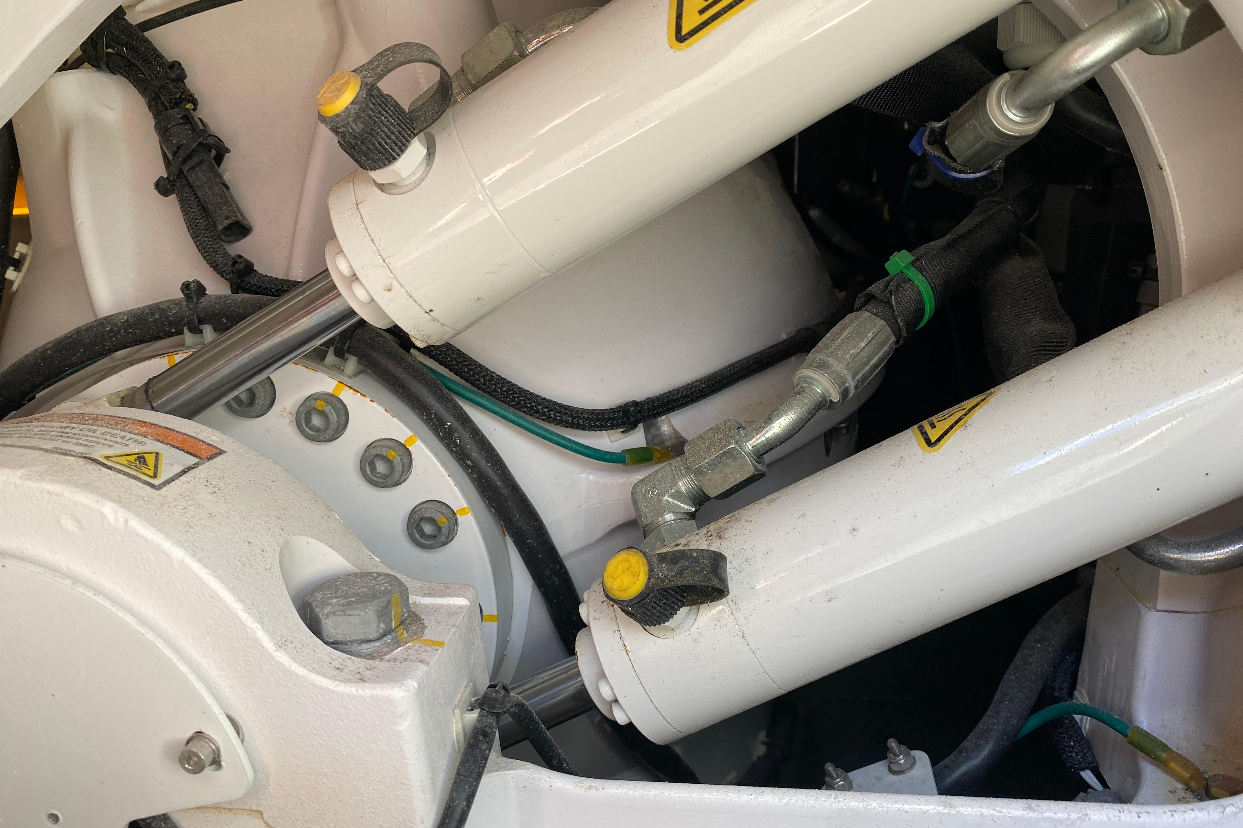 Close-up of hydraulic system components on a 2021 Boston Whaler 345 Conquest boat.