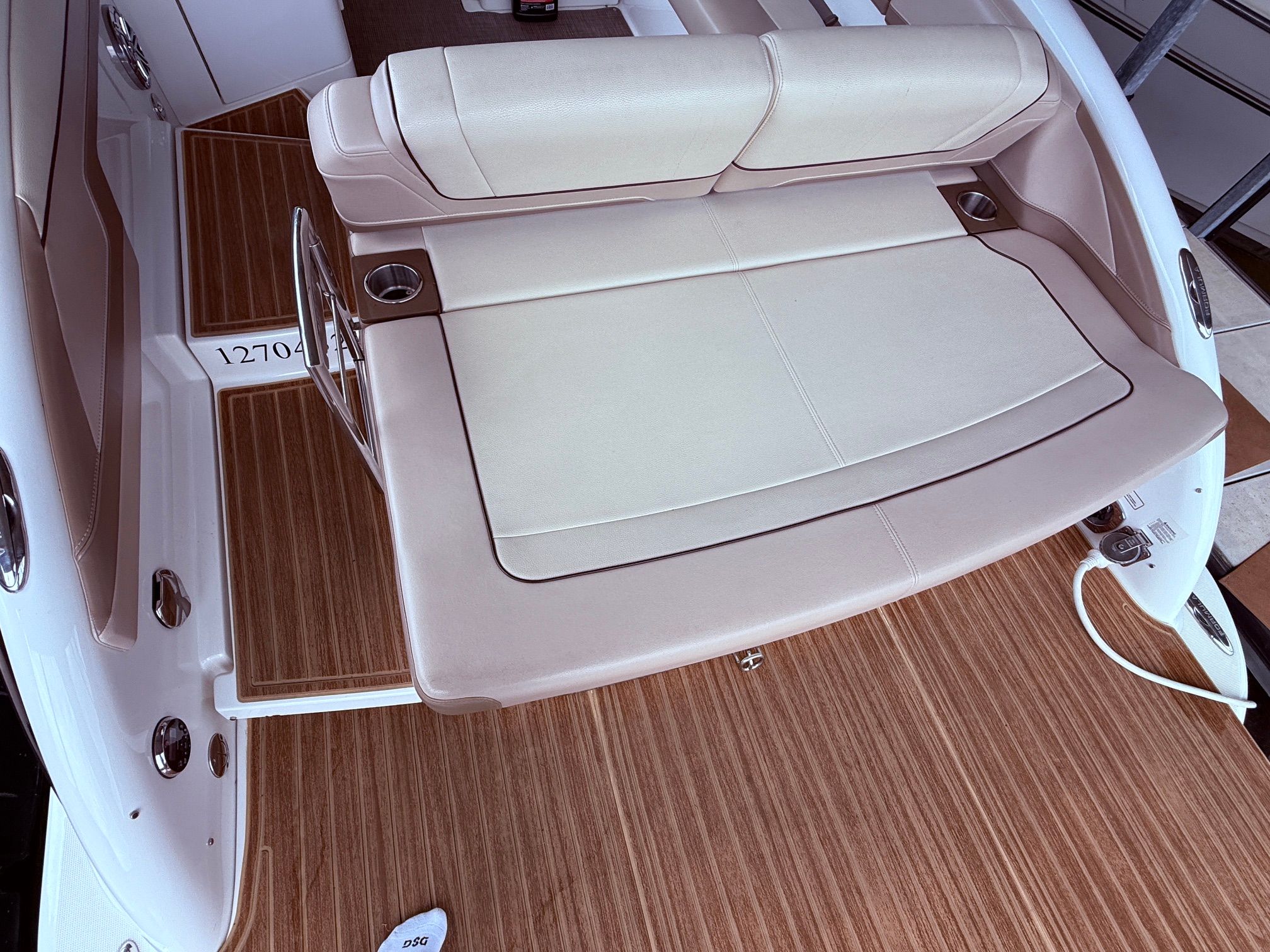Interior of a 2016 Formula 310 BR boat with beige seating area.